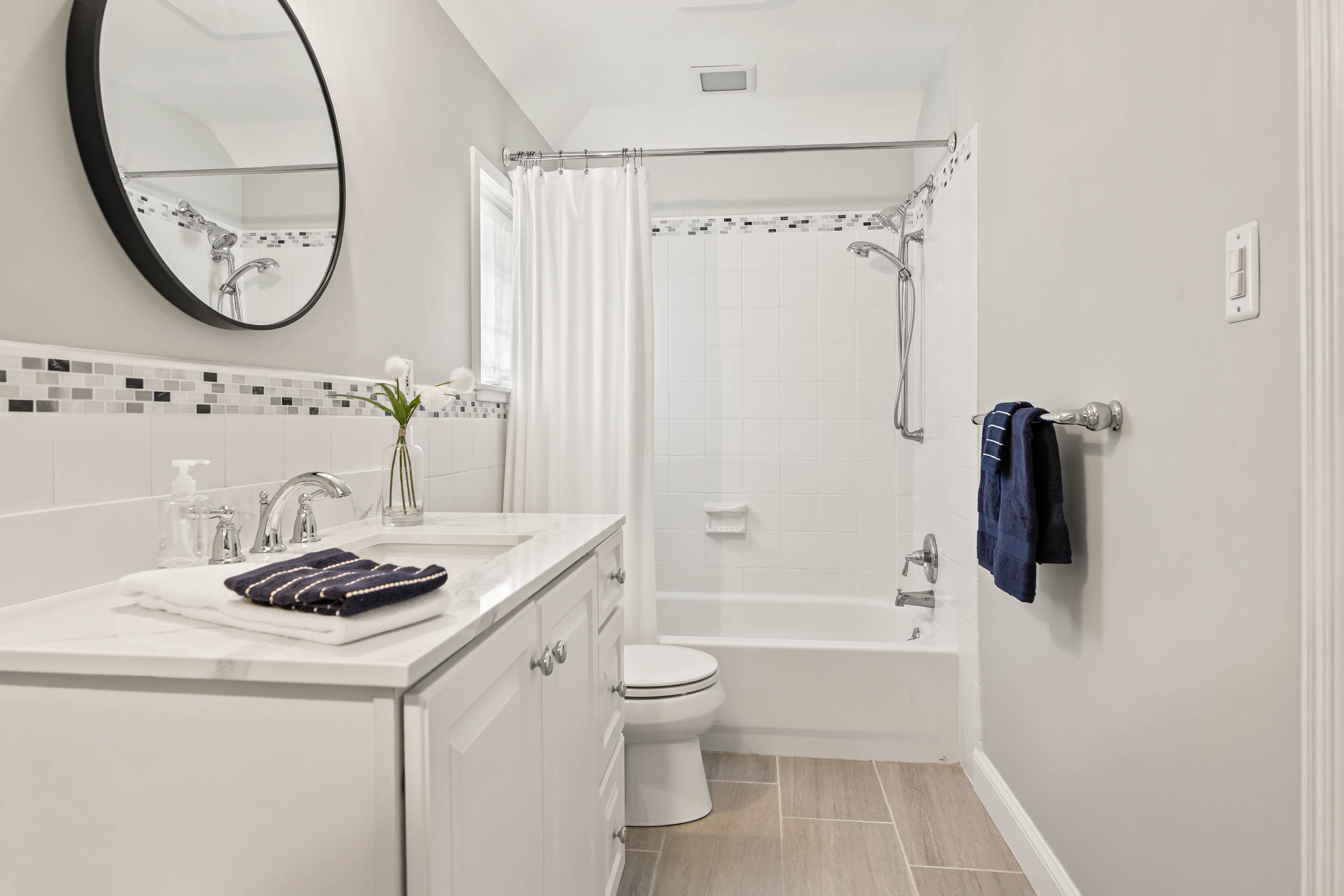 1136 Seaton Ross Road Wayne, PA 19087 - Photo 31 of 48 a bathroom with a granite countertop sink a toilet and a mirror