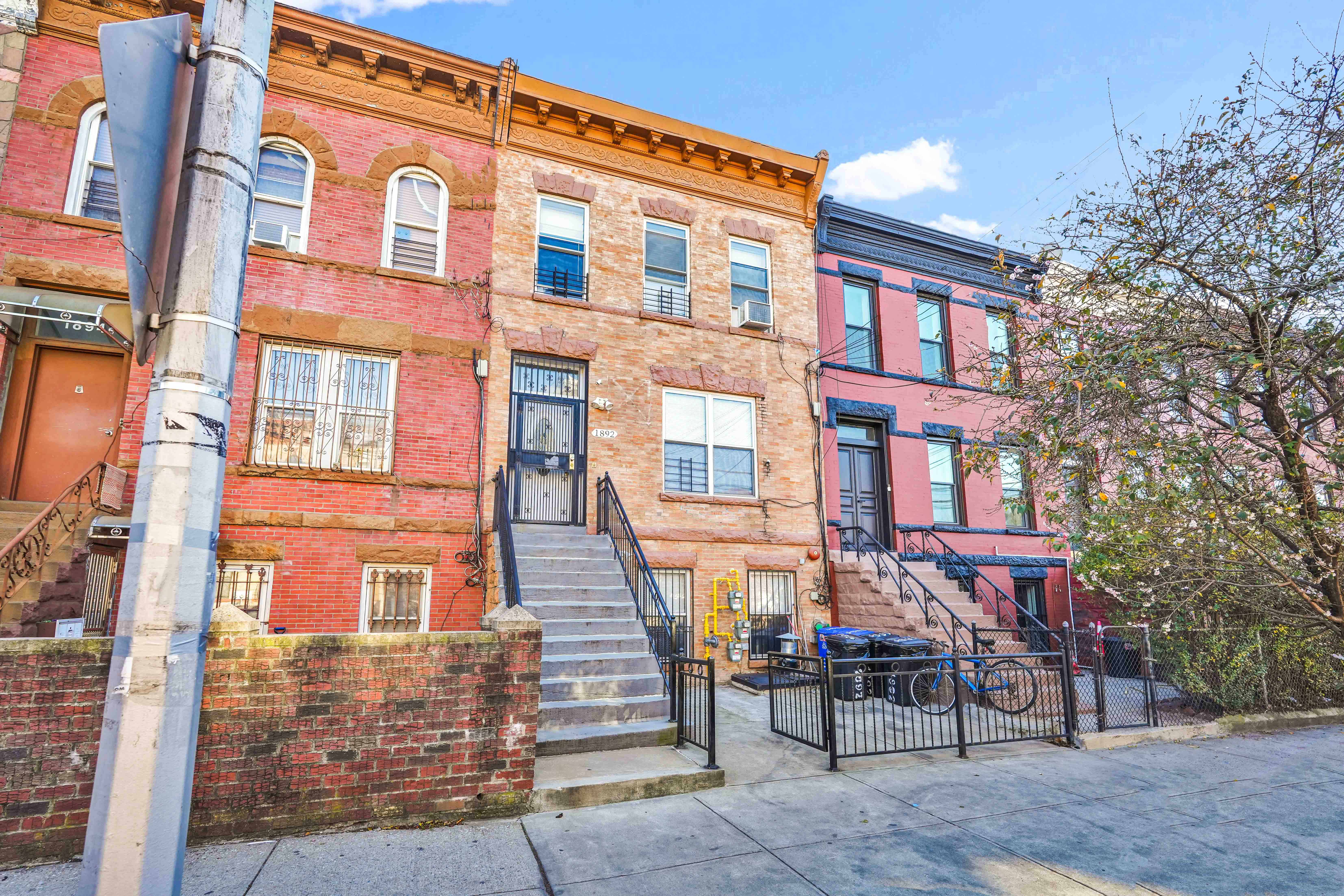 a front view of a brick building with many windows