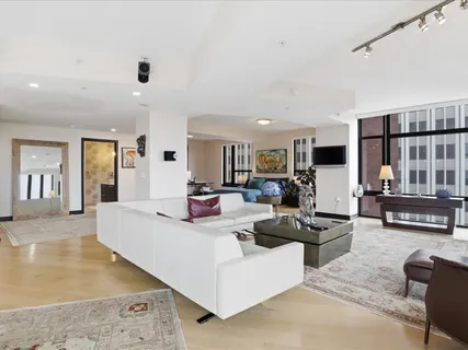 a living room with furniture and a table