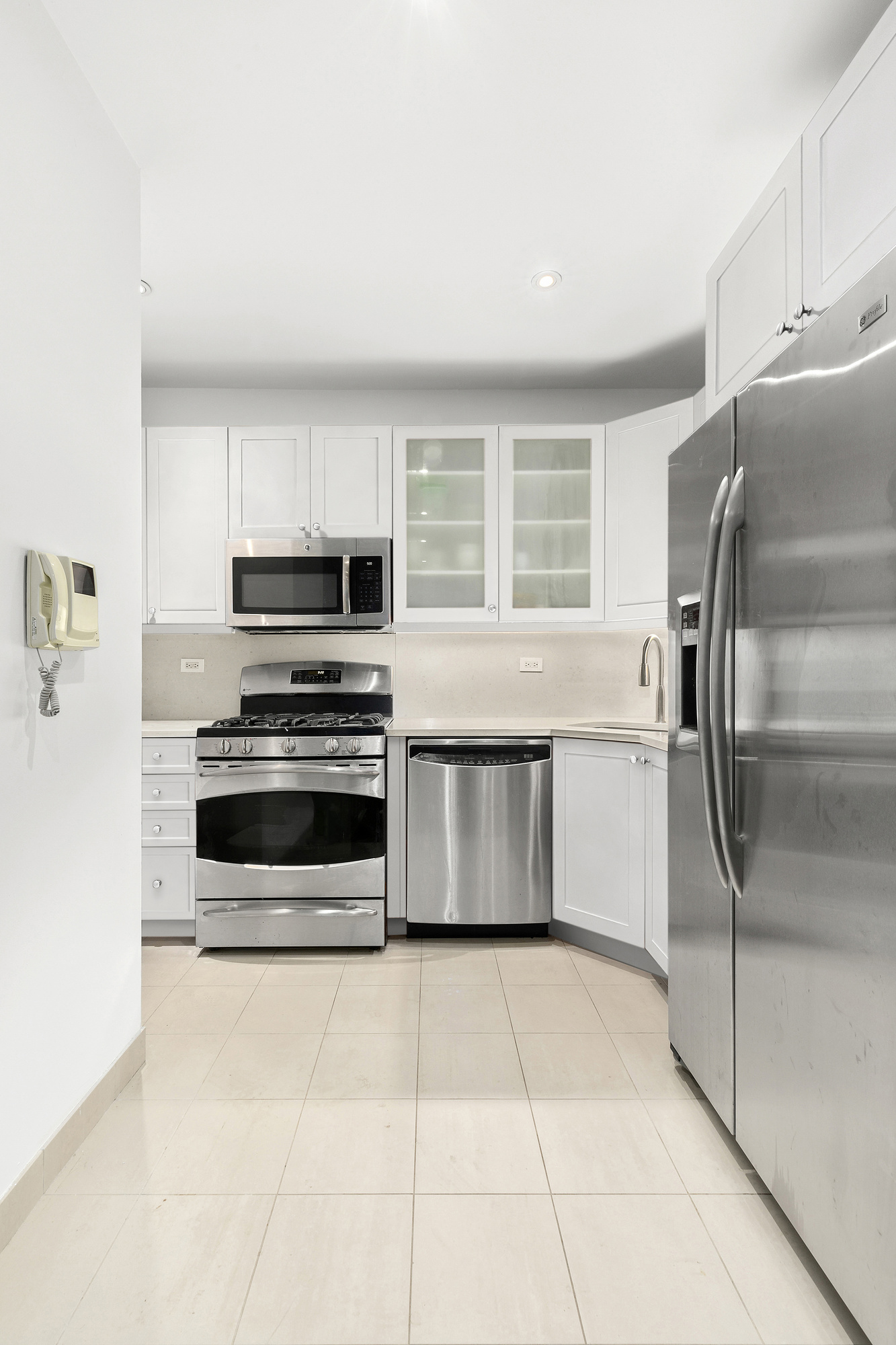 505 Court Street, Unit 3D Brooklyn, NY 11231 - Photo 7 of 14 a kitchen with stainless steel appliances a refrigerator sink and microwave