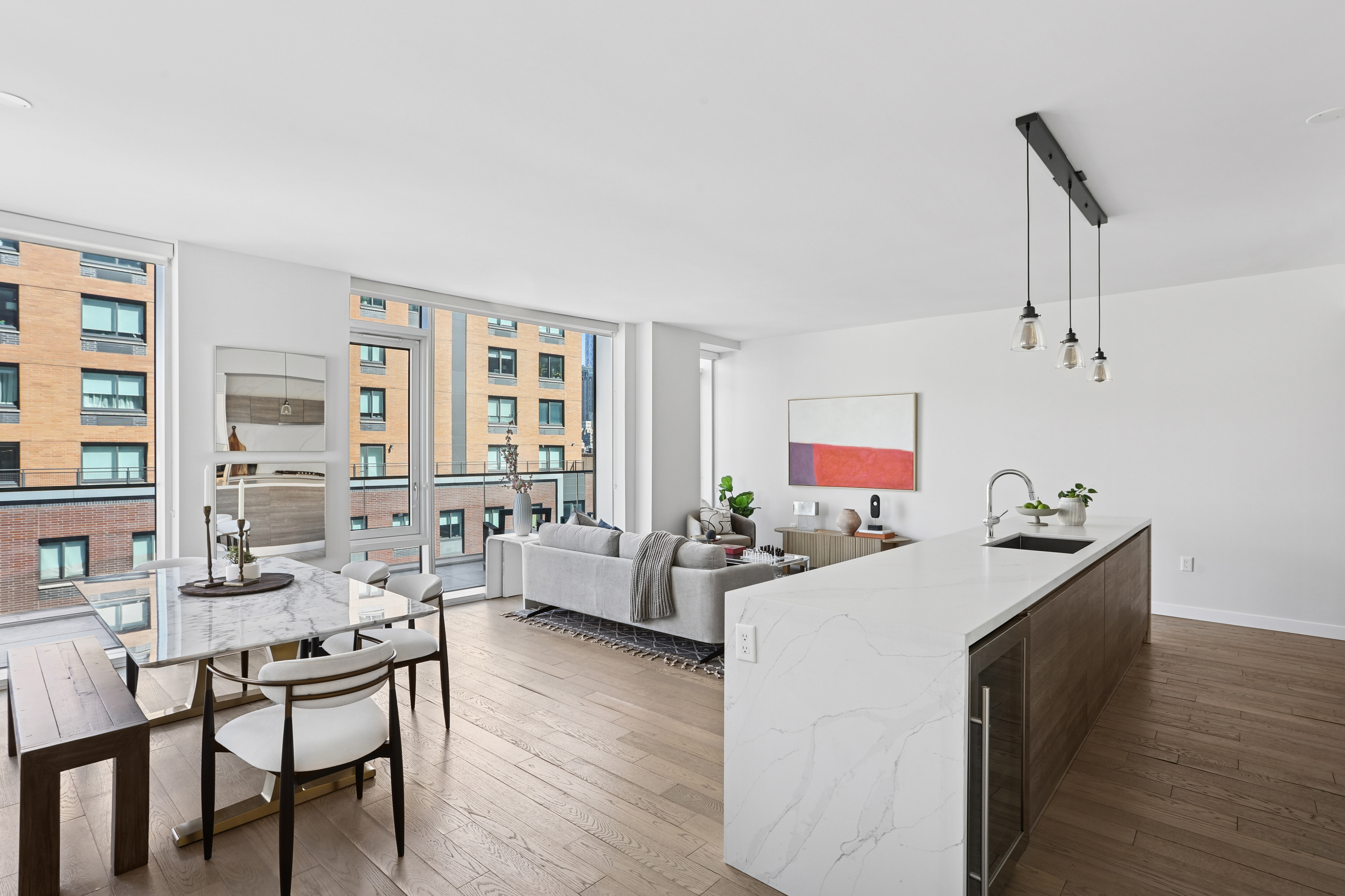 505-513 West 43rd Street, Unit 10B Manhattan, NY 10036 - Photo 2 of 22 a living room with furniture and a wooden floor