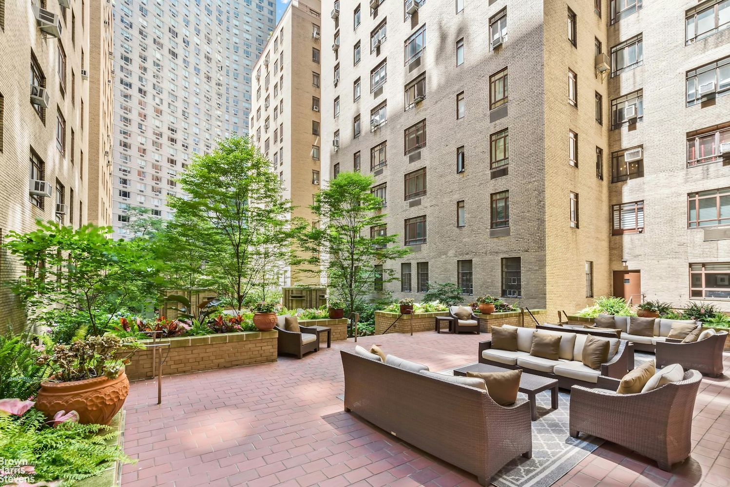 25 Central Park West, Unit 14R Manhattan, NY 10023 - Photo 18 of 22 a view of a patio with couches and a potted plant