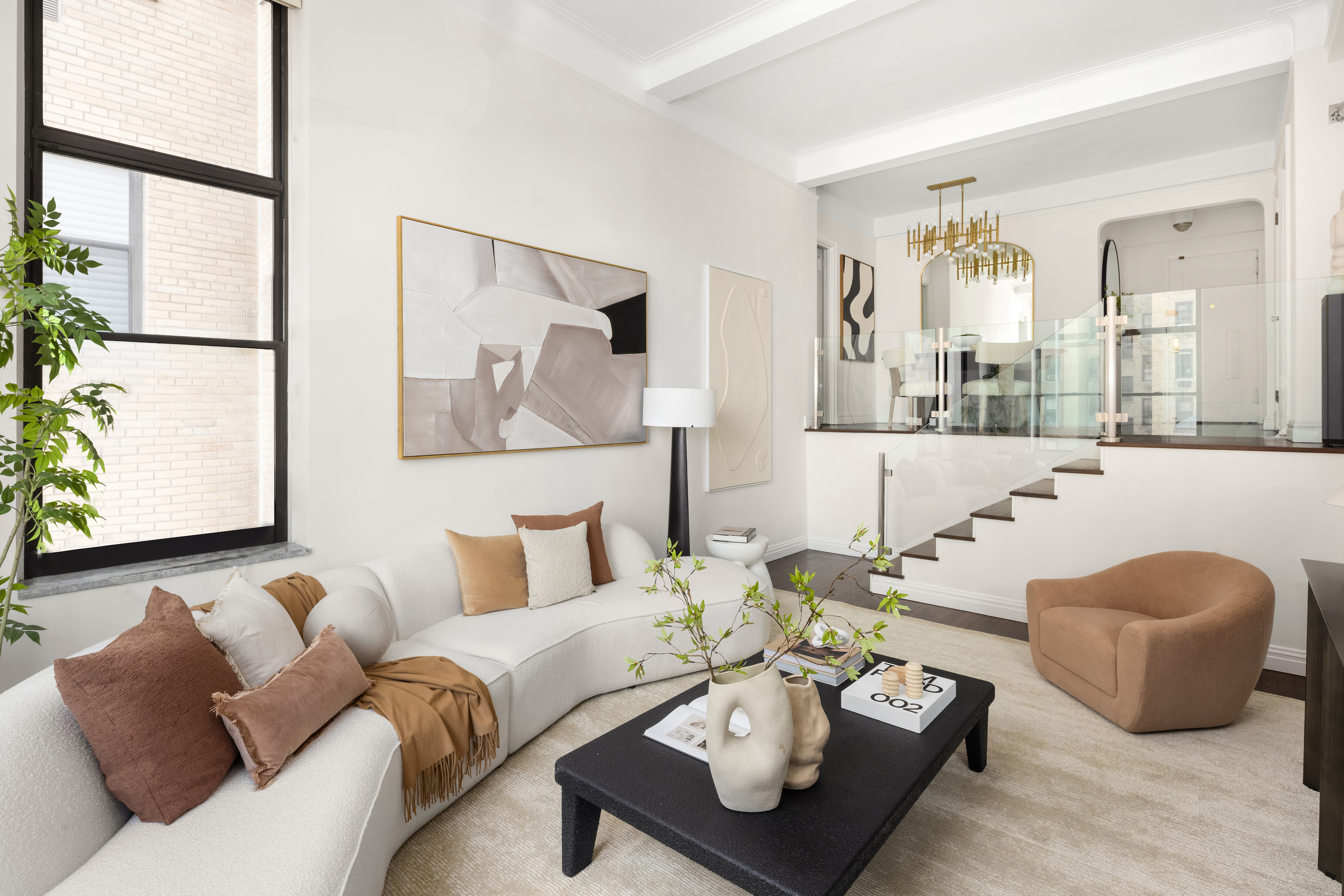 49 East 96th Street, Unit 9B Manhattan, NY 10128 - Photo 4 of 15 a living room with furniture and wooden floor