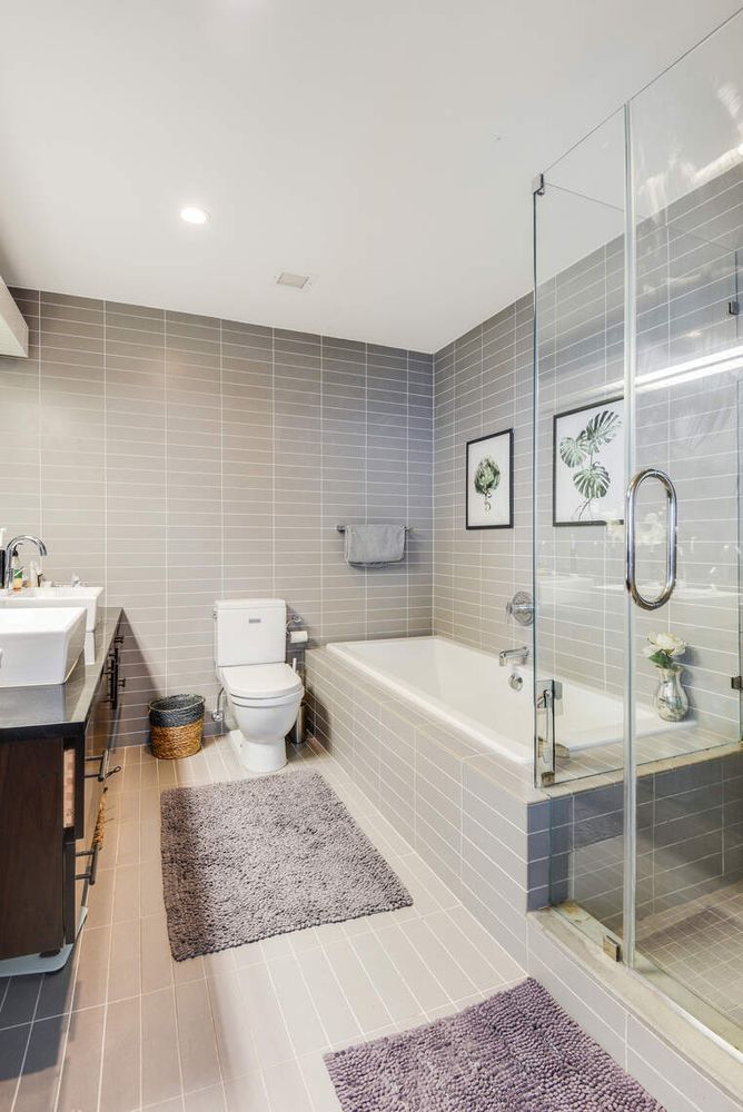 150 Myrtle Avenue, Unit PH3201 Brooklyn, NY 11201 - Photo 17 of 40 a bathroom with a granite countertop sink a toilet and bathtub
