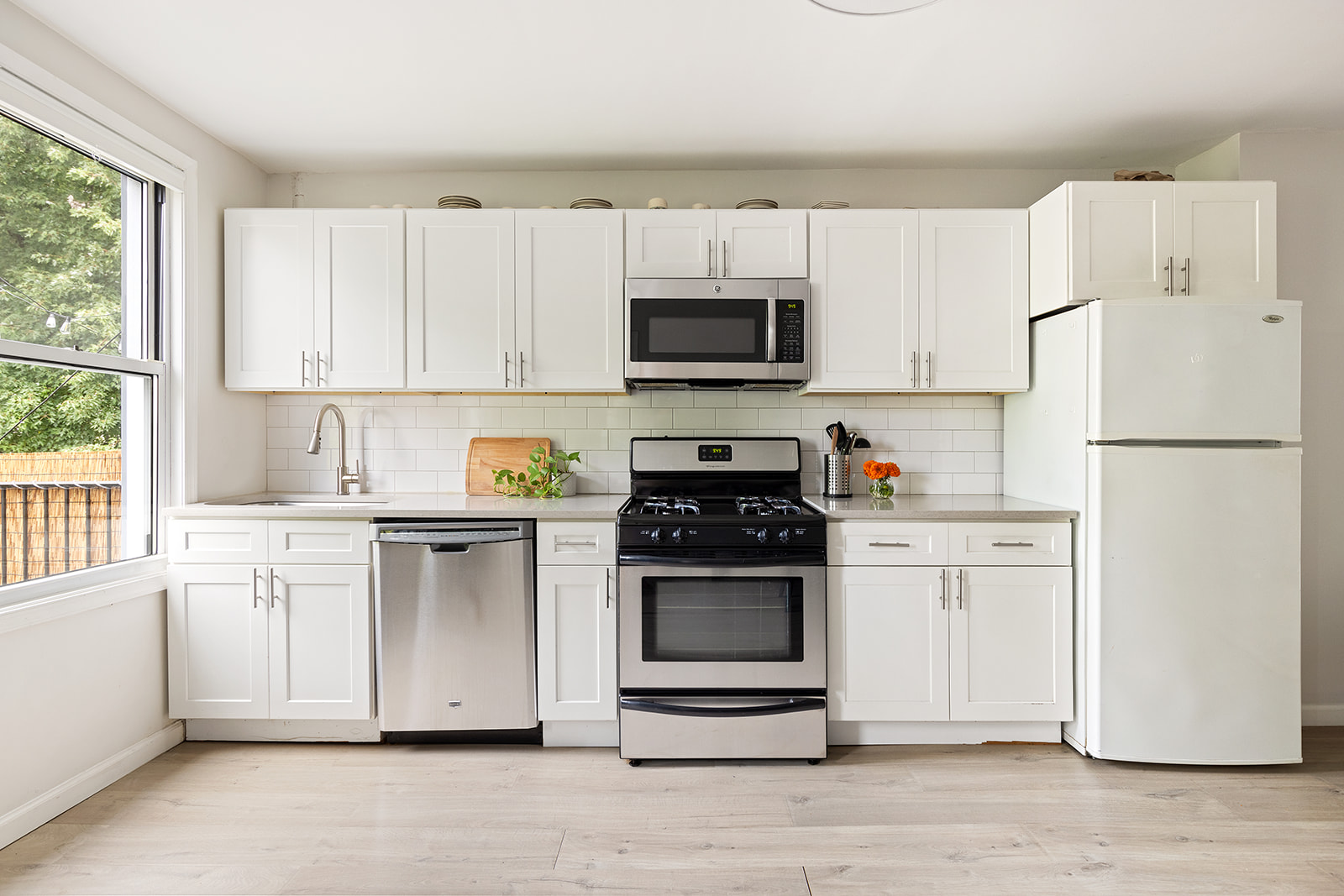 682 A 6th Avenue Brooklyn, NY 11215 - Photo 12 of 16 a kitchen with stainless steel appliances granite countertop a refrigerator stove a sink and a microwave
