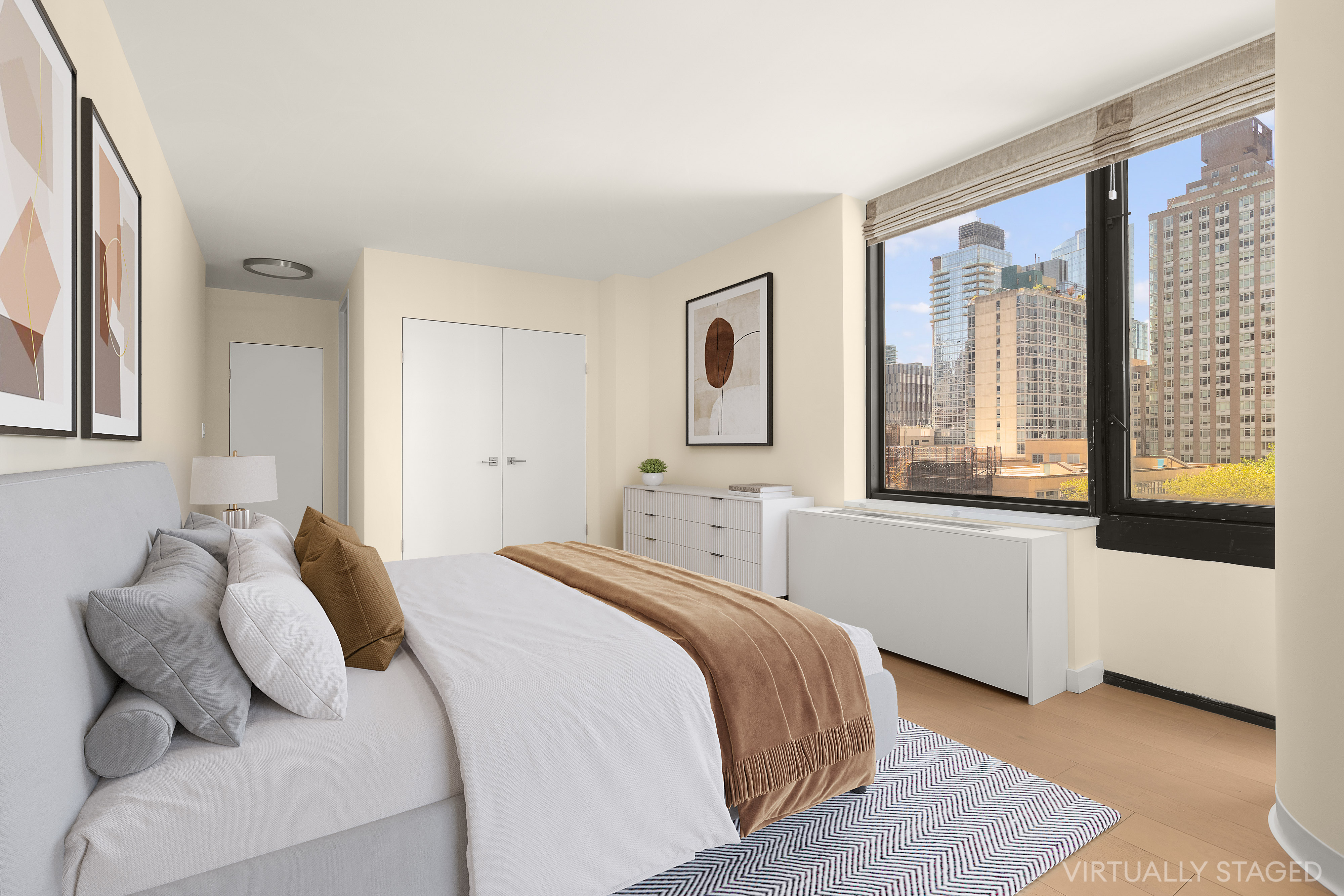 161 West 61st Street, Unit 5C Manhattan, NY 10023 - Photo 16 of 30 a bedroom with a bed and a large window