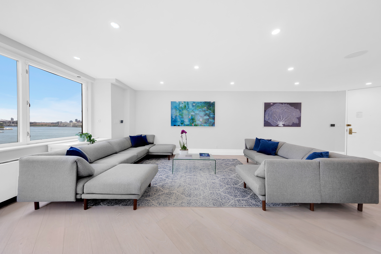 415 East 37th Street, Unit 9JK Manhattan, NY 10016 - Photo 1 of 28 a living room with furniture and a large window