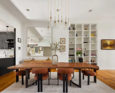 a dining room with furniture and wooden floor