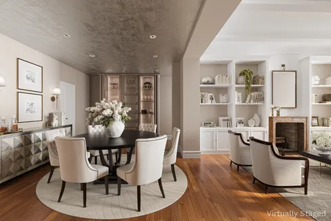 a dining room with furniture a window and wooden floor