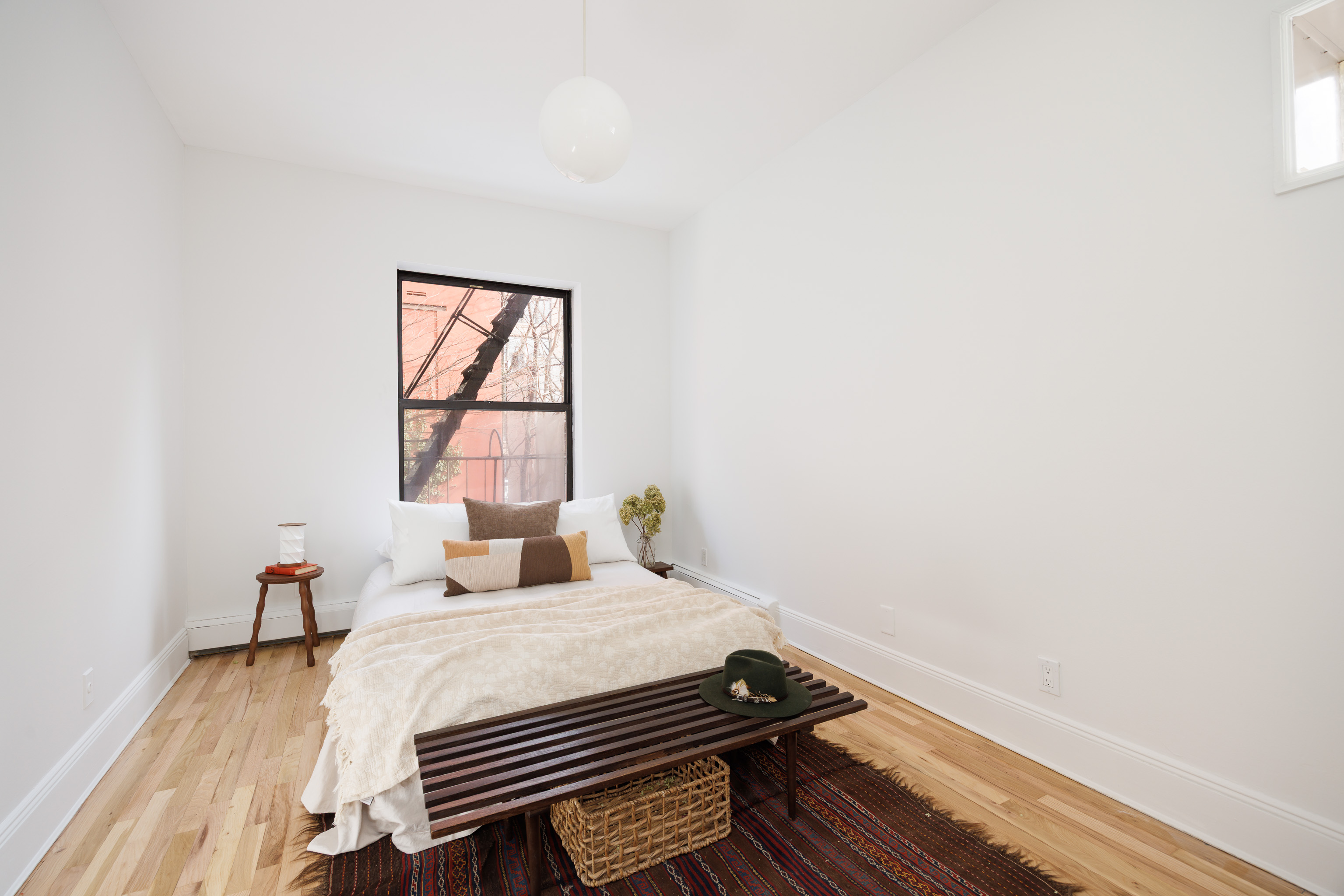 297 Classon Avenue, Unit 3R Brooklyn, NY 11205 - Photo 5 of 9 a bedroom with a bed and wooden floor
