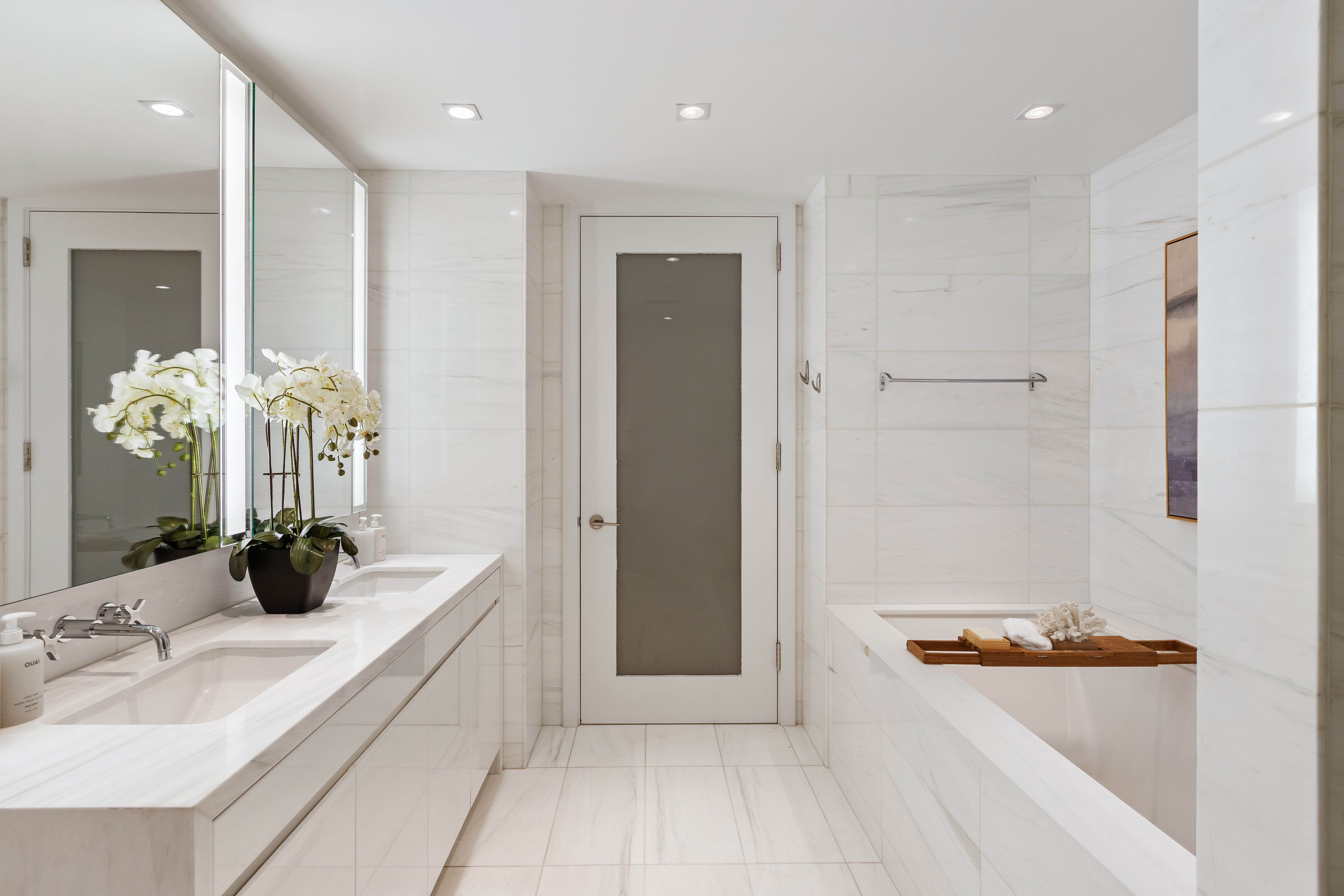 1355 1st Avenue, Unit 8 Manhattan, NY 10021 - Photo 17 of 25 a bathroom with a tub sink and mirror