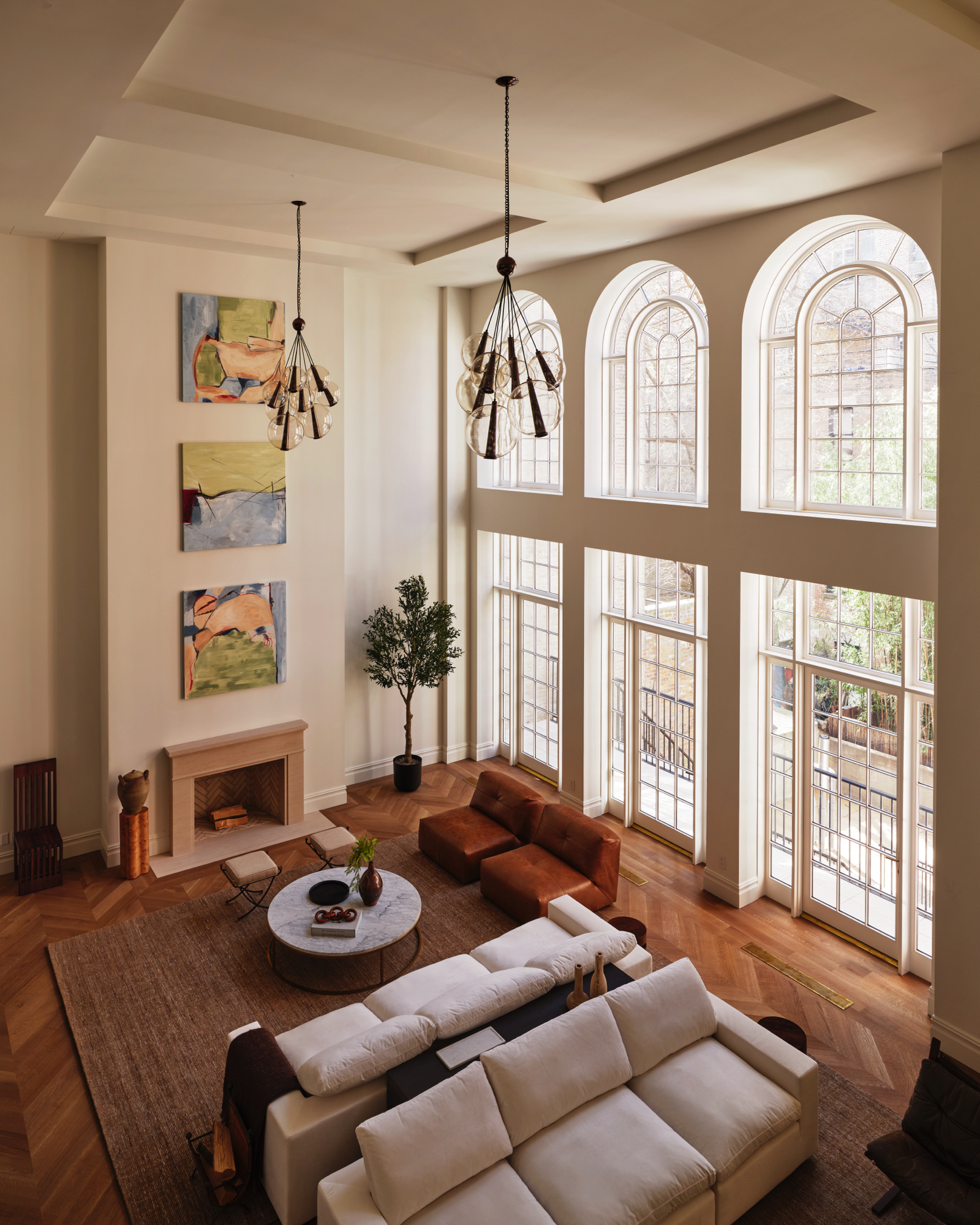 48-50 West 69th Street Manhattan, NY 10023 - Photo 3 of 33 a living room with furniture and a large window