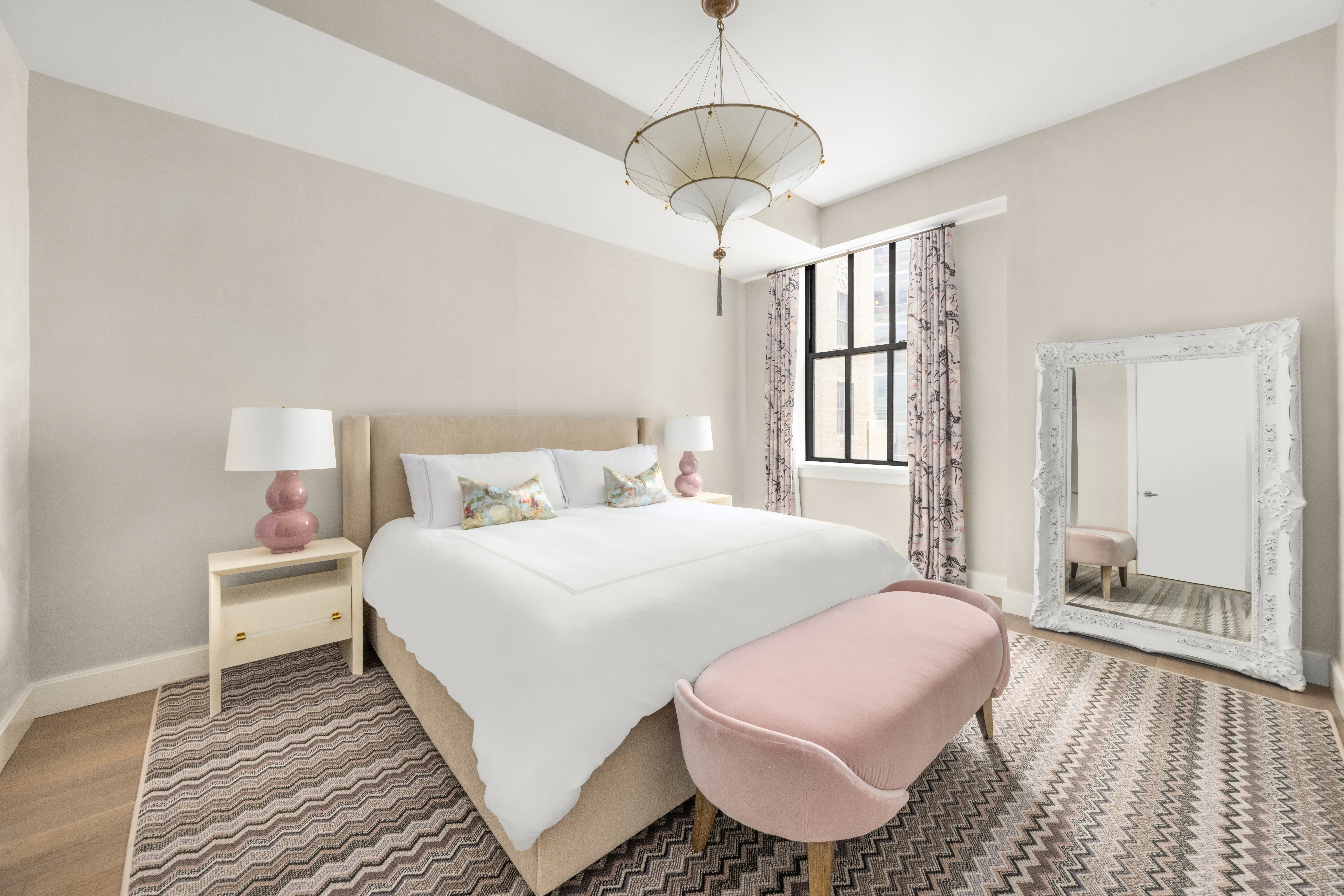 100 Barclay Street, Unit 16H Manhattan, NY 10007 - Photo 5 of 12 a room with a bed and a couch