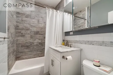 a bathroom with a sink a toilet and a bathtub