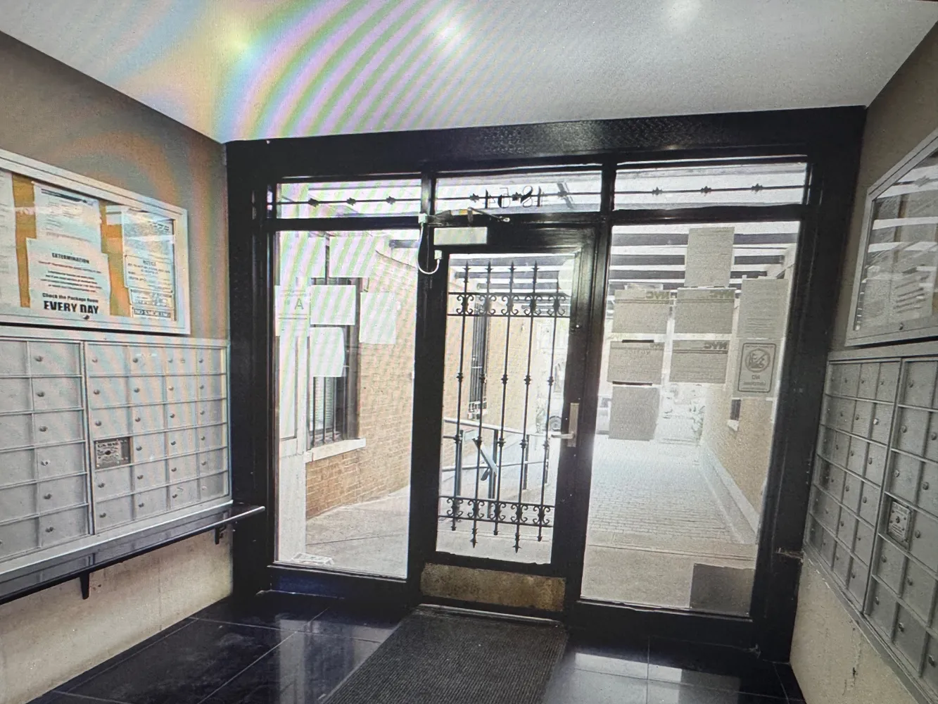 a view of an entryway with wooden floor