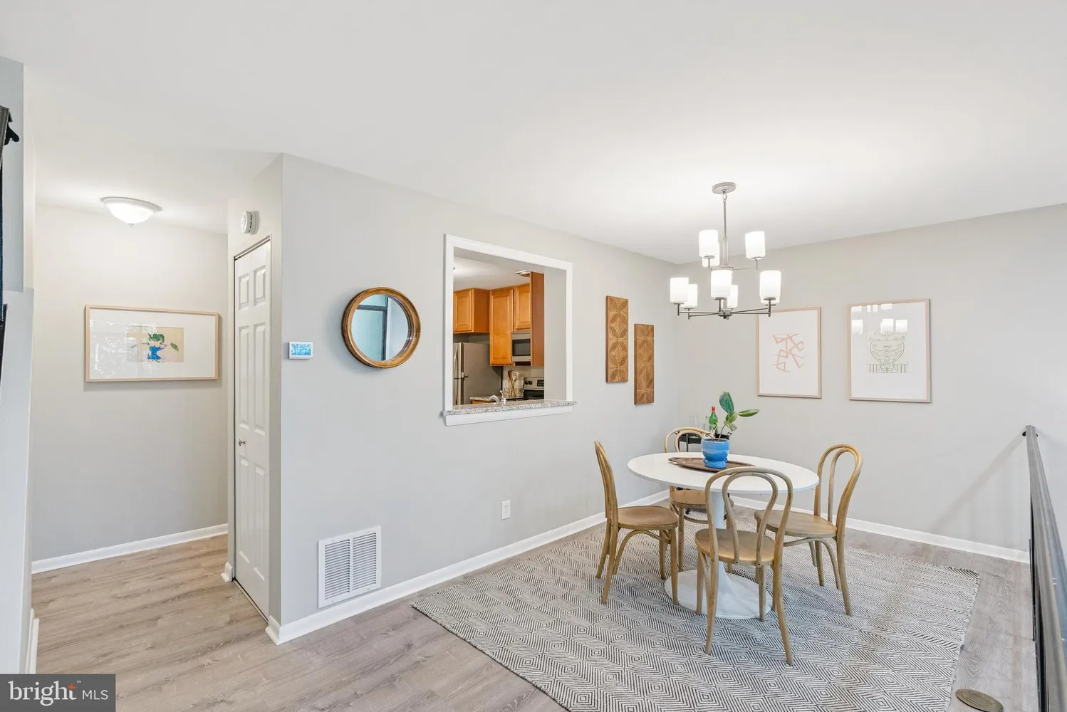 a bathroom with a granite countertop toilet sink and mirror