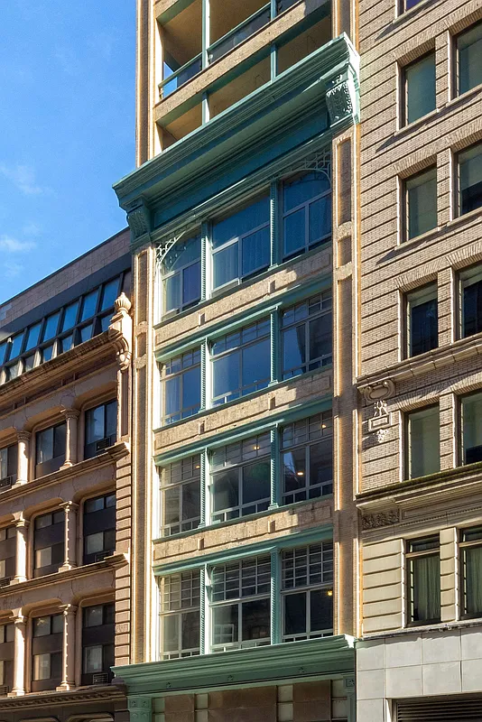 354 Broadway, Unit 4 Manhattan, NY 10013 - Photo 12 of 13 a large building with a lot of windows