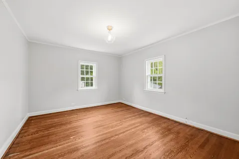 a view of entryway with wooden floor and stairs
