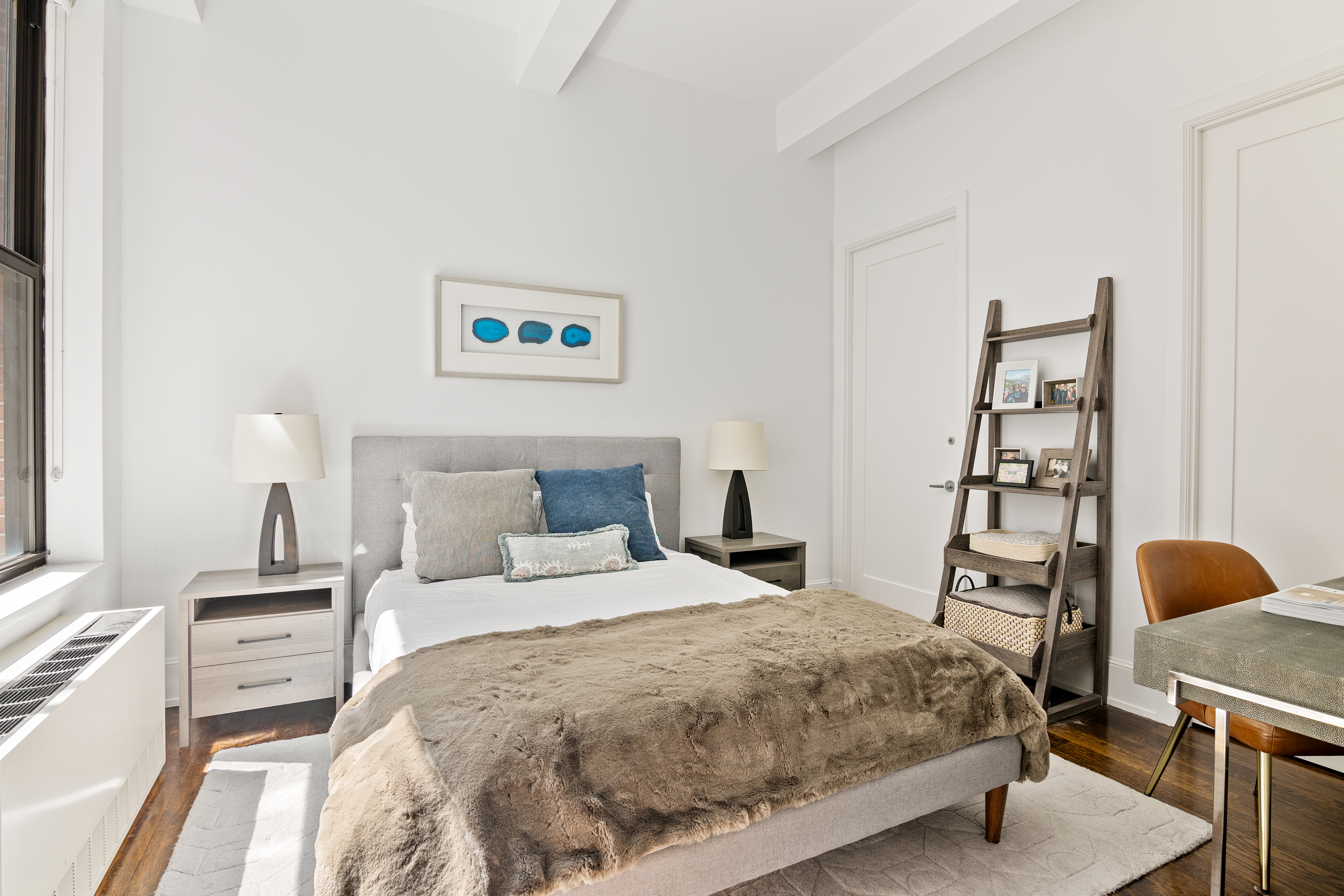 260 Park Avenue South, Unit 6I Manhattan, NY 10010 - Photo 6 of 9 a bedroom with a bed and a window