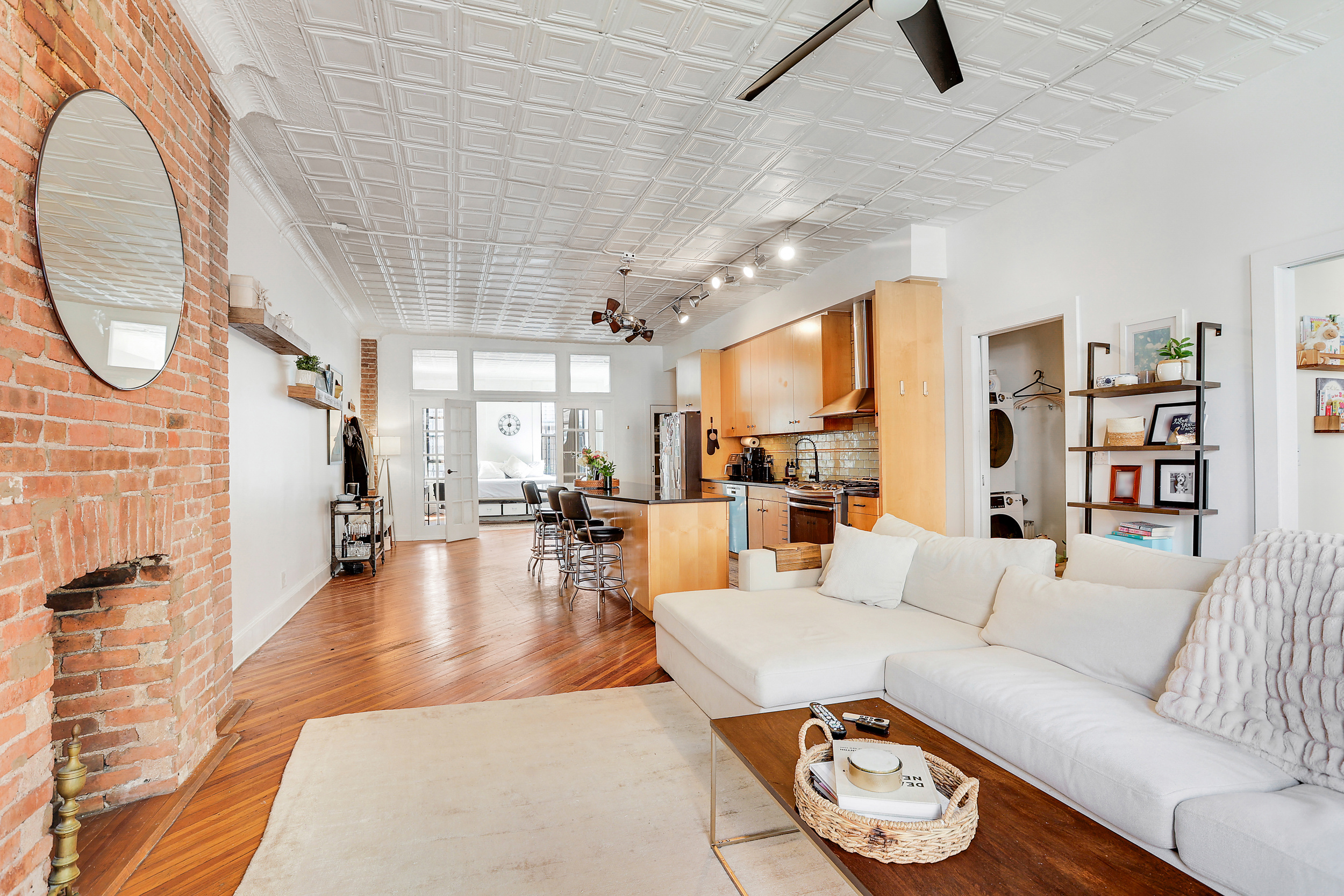 5 Great Jones Street Manhattan, NY 10012 - Photo 1 of 11 a living room with furniture and a wooden floor