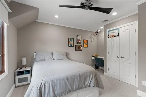 a bedroom with a bed and a flat screen television