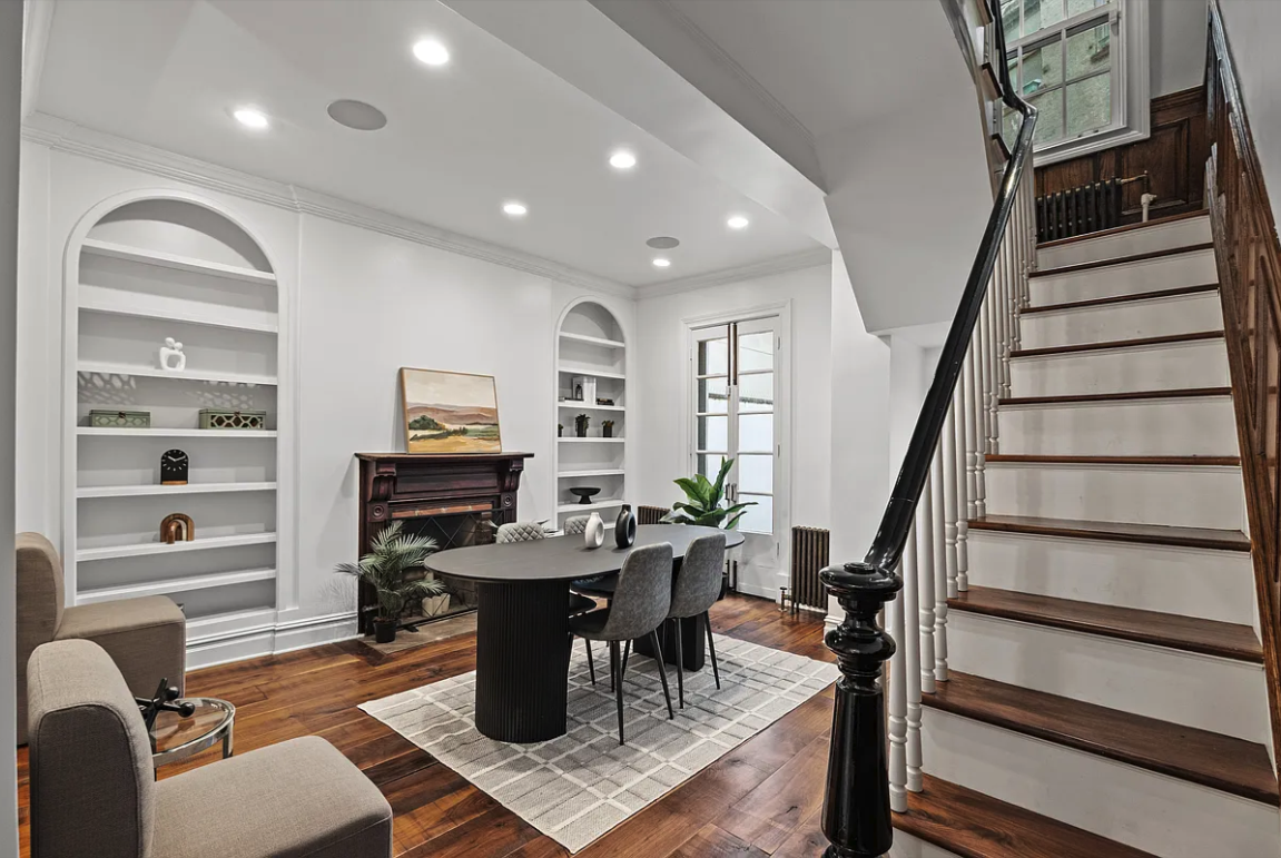 58 Downing Street Manhattan, NY 10014 - Photo 5 of 21 a living room with furniture a rug and a window