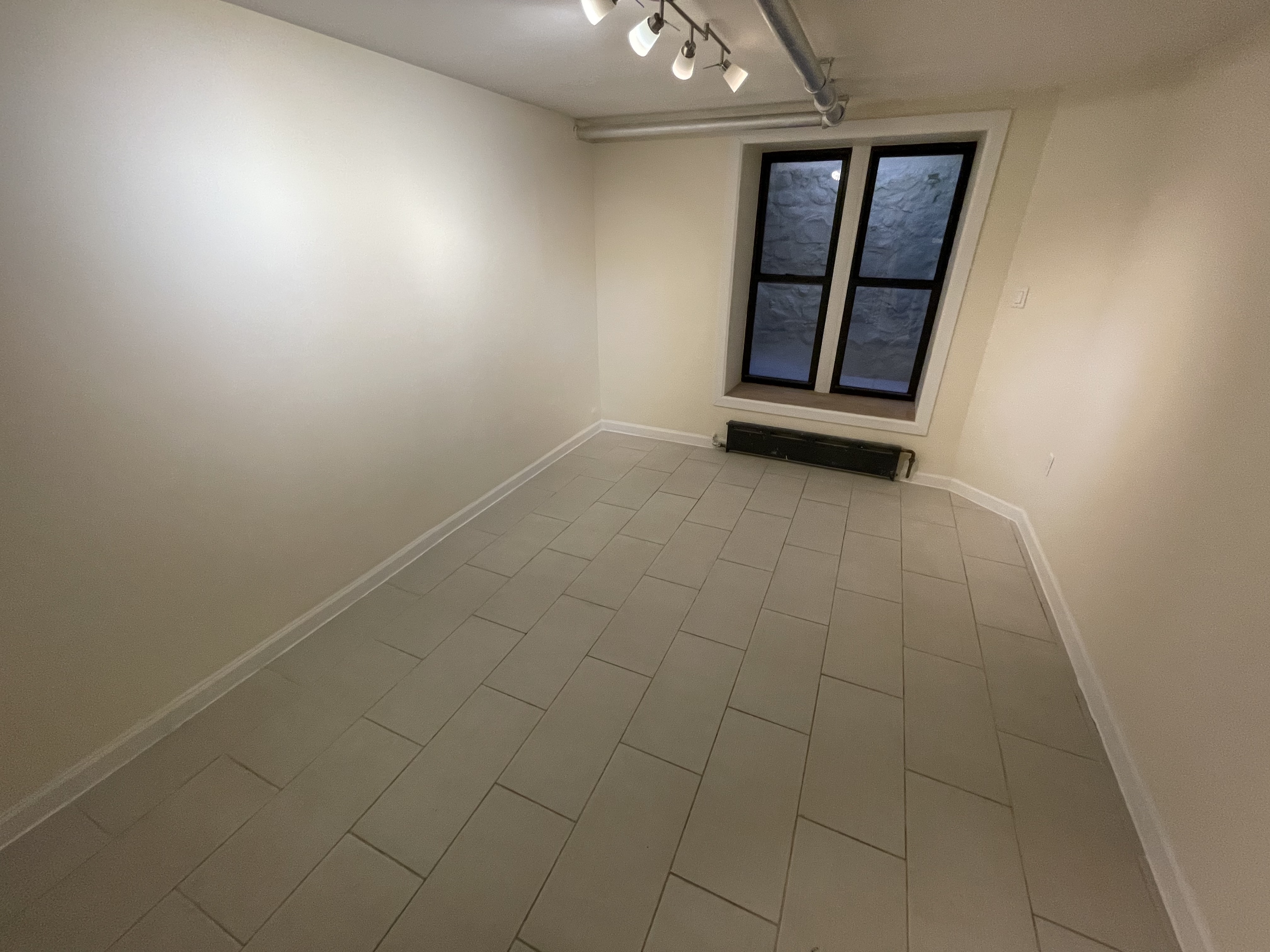 357 Sterling Place, Unit A2 Brooklyn, NY 11238 - Photo 4 of 8 an empty room with windows