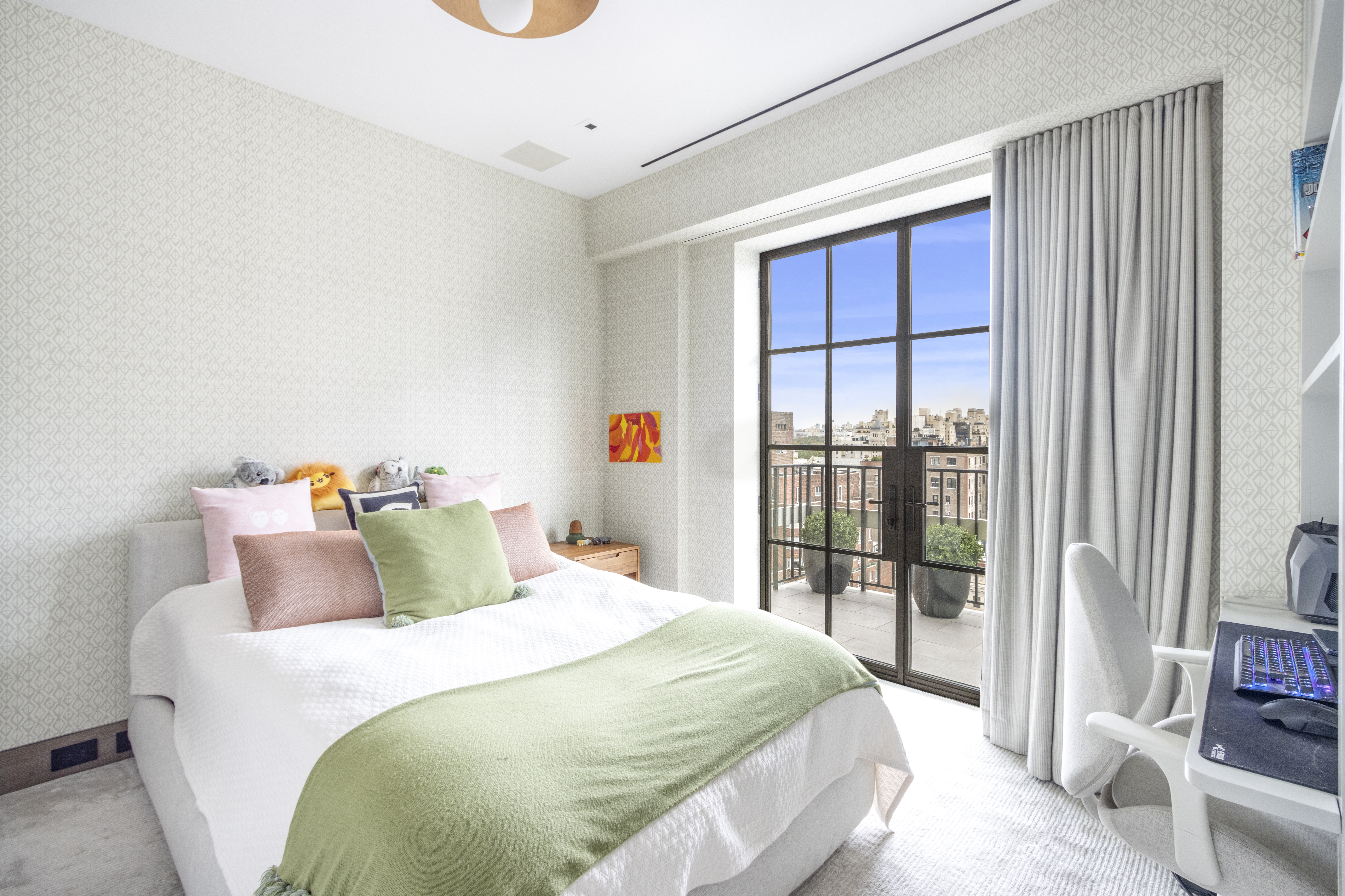 40 East 61st Street, Unit 18A Manhattan, NY 10065 - Photo 10 of 15 a bedroom with a bed and a large window