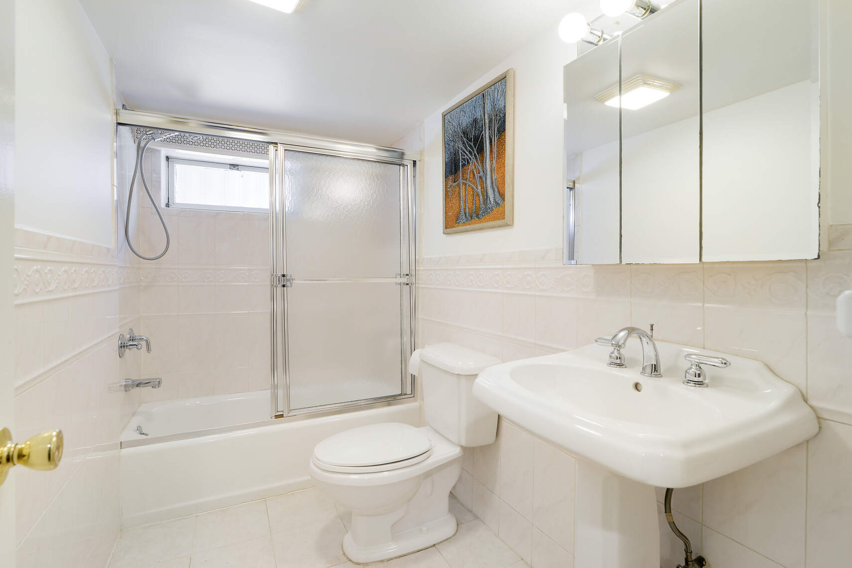 139 82nd Street Brooklyn, NY 11209 - Photo 20 of 23 a bathroom with a sink a toilet and shower