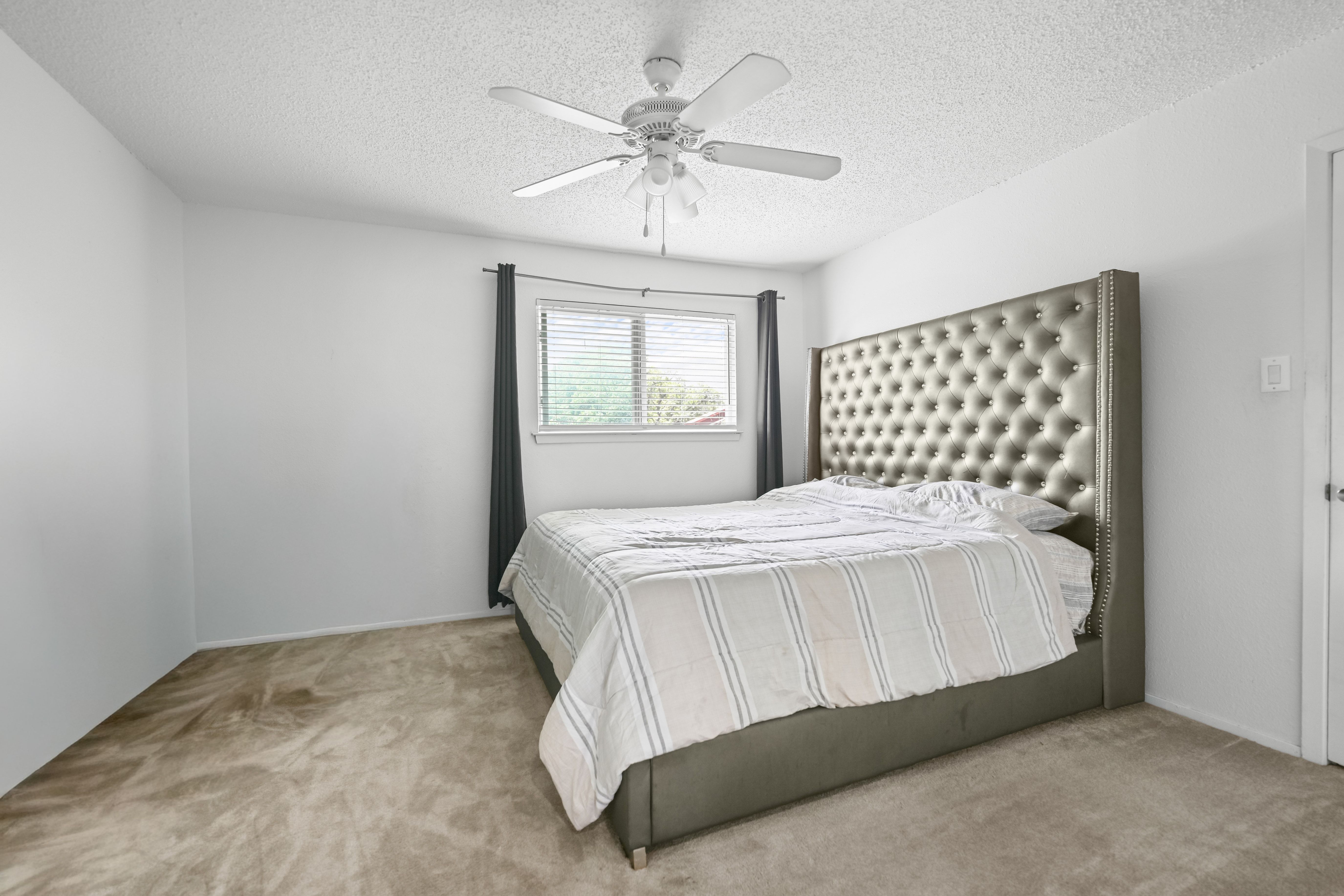 8710 Clearbrook Trail Austin, TX 78729 - Photo 23 of 28 a bedroom with a bed and window