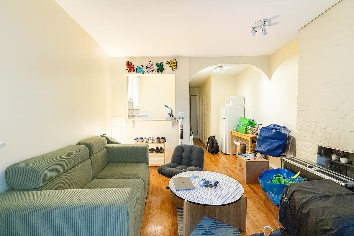 229 East 29th Street, Unit 3A Manhattan, NY 10016 - Photo 4 of 7 a living room with furniture and a large window