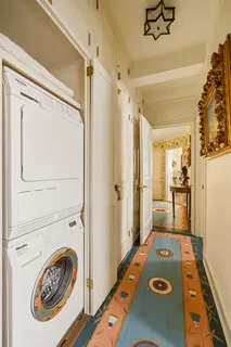 a view of livingroom with washer and dryer