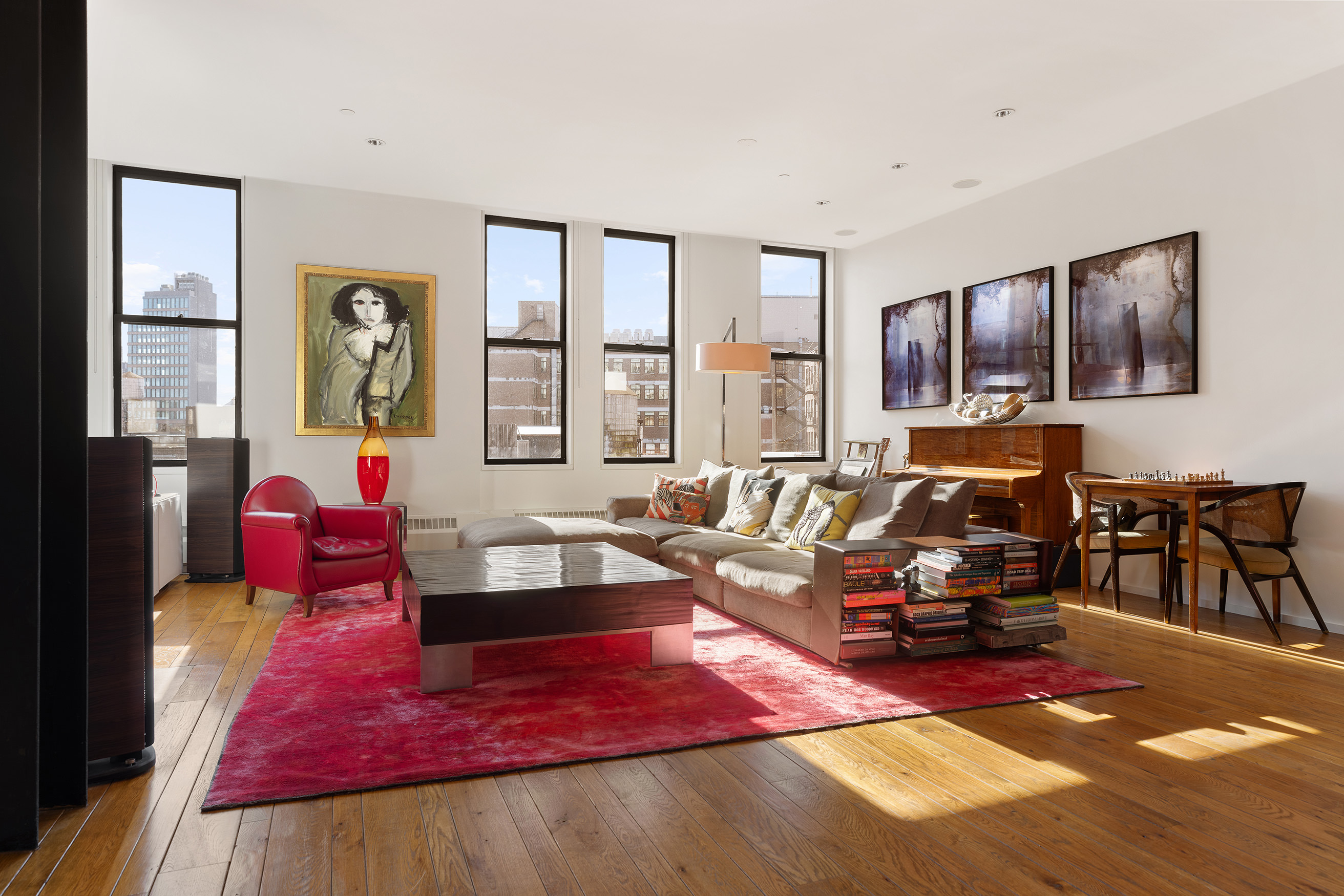 21 Astor Place, Unit 9E Manhattan, NY 10003 - Photo 3 of 10 a living room with furniture or couch and two windows