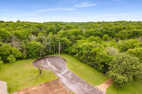 a view of a lake with a yard