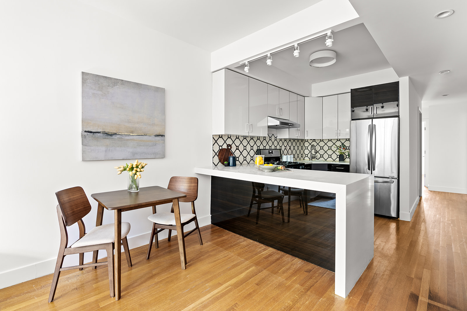 495 Rutland Road, Unit 3 Brooklyn, NY 11203 - Photo 3 of 12 a kitchen with a table and chairs in it