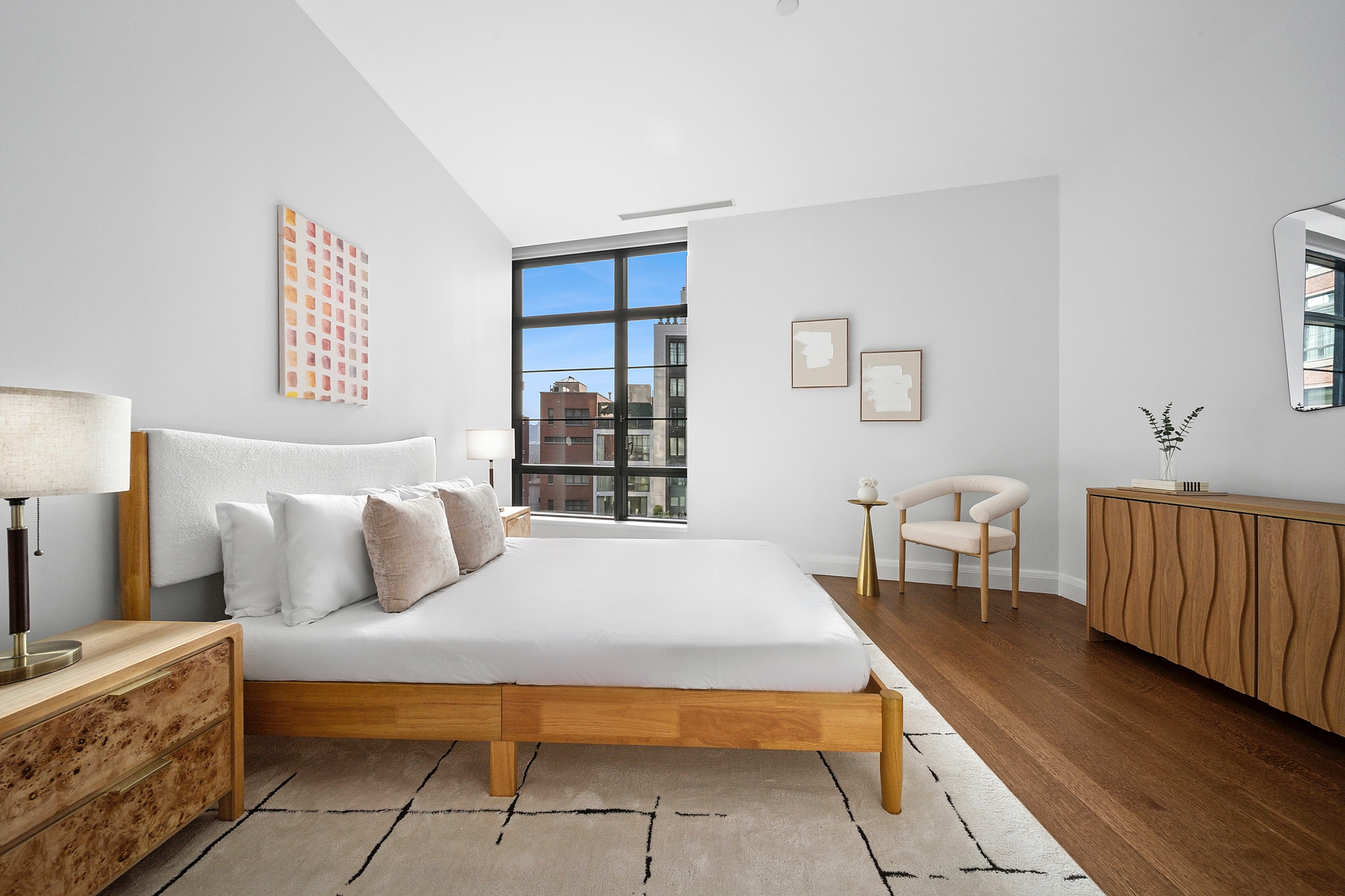 150 Charles Street, Unit 4AN Manhattan, NY 10014 - Photo 8 of 19 a bedroom with a bed and a table in it