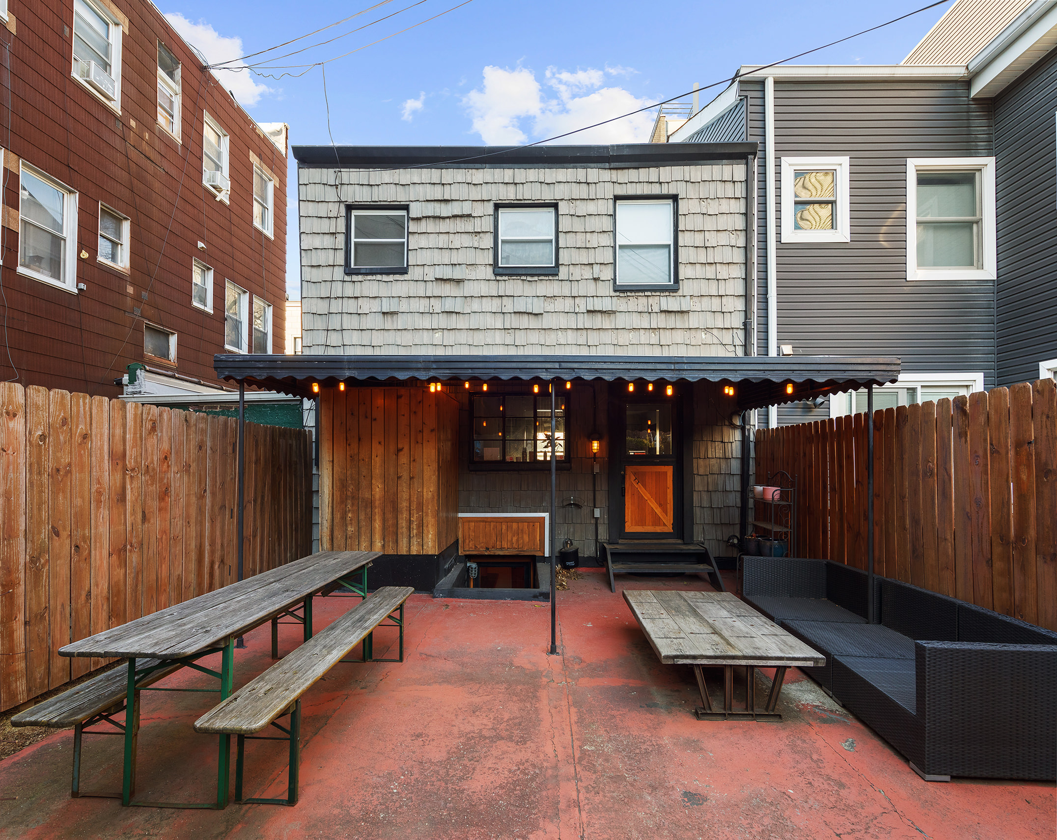 214 Withers Street Brooklyn, NY 11211 - Photo 9 of 10 a balcony with furniture and some potted plants