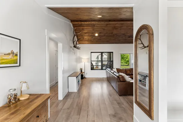 a kitchen with stainless steel appliances a refrigerator a stove a sink and a center island