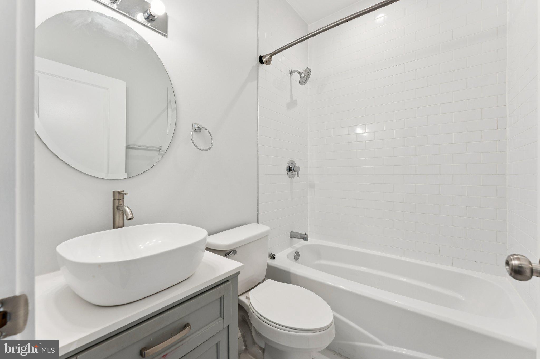 2822 28th Street Southeast Washington, DC 20020 - Photo 32 of 57 a bathroom with a toilet a sink and bathtub