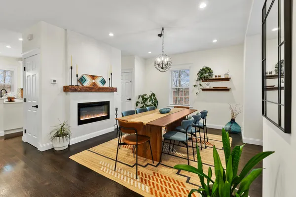 a view of a dining room with furniture window and wooden floor