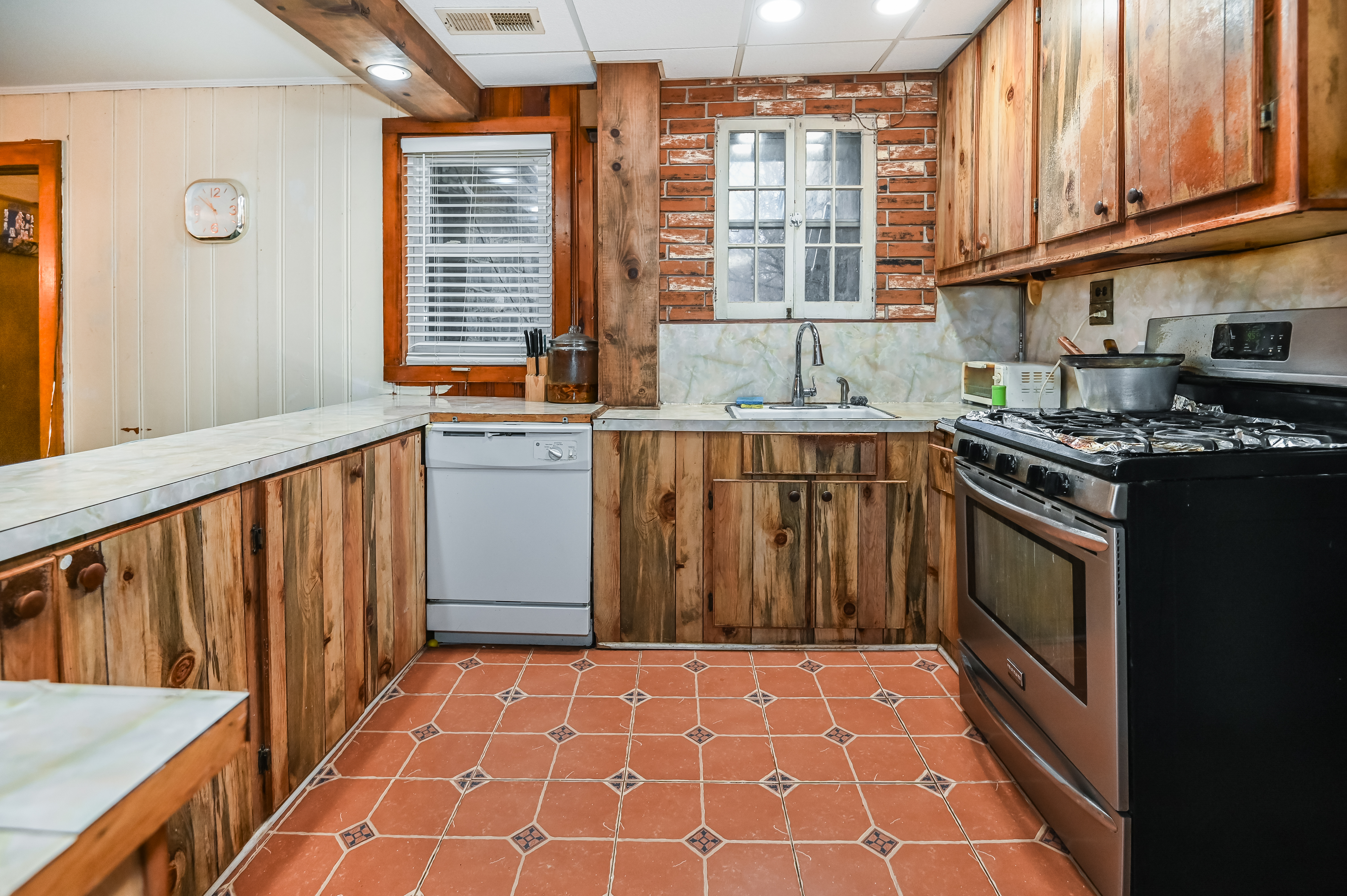 137 Hiawatha Boulevard Lake Hiawatha, NJ 07034 - Photo 12 of 21 a kitchen with stainless steel appliances a stove a sink and a microwave