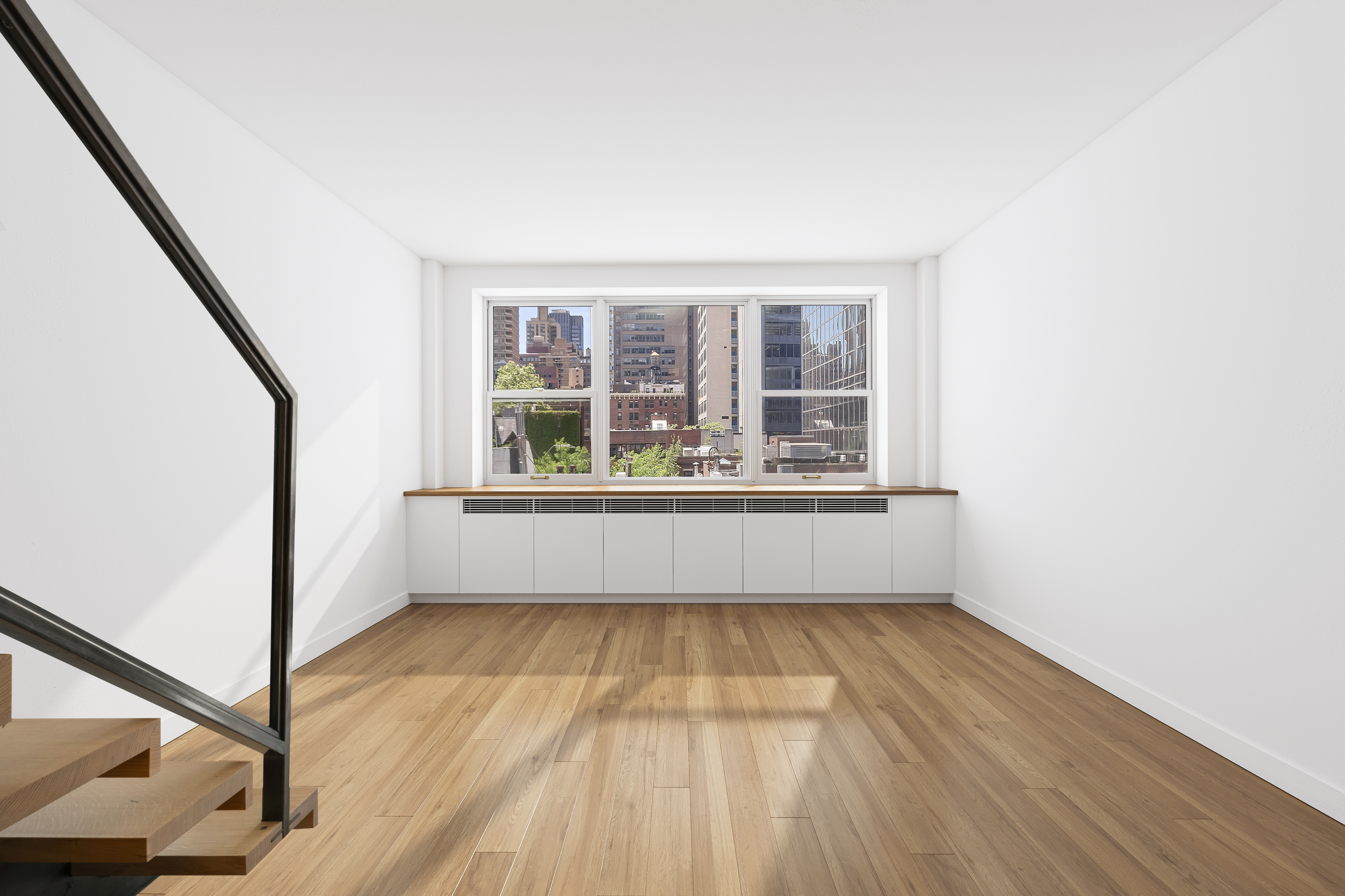 221 East 50th Street, Unit 6D/7D Manhattan, NY 10022 - Photo 2 of 19 a view of an empty room with wooden floor and a window