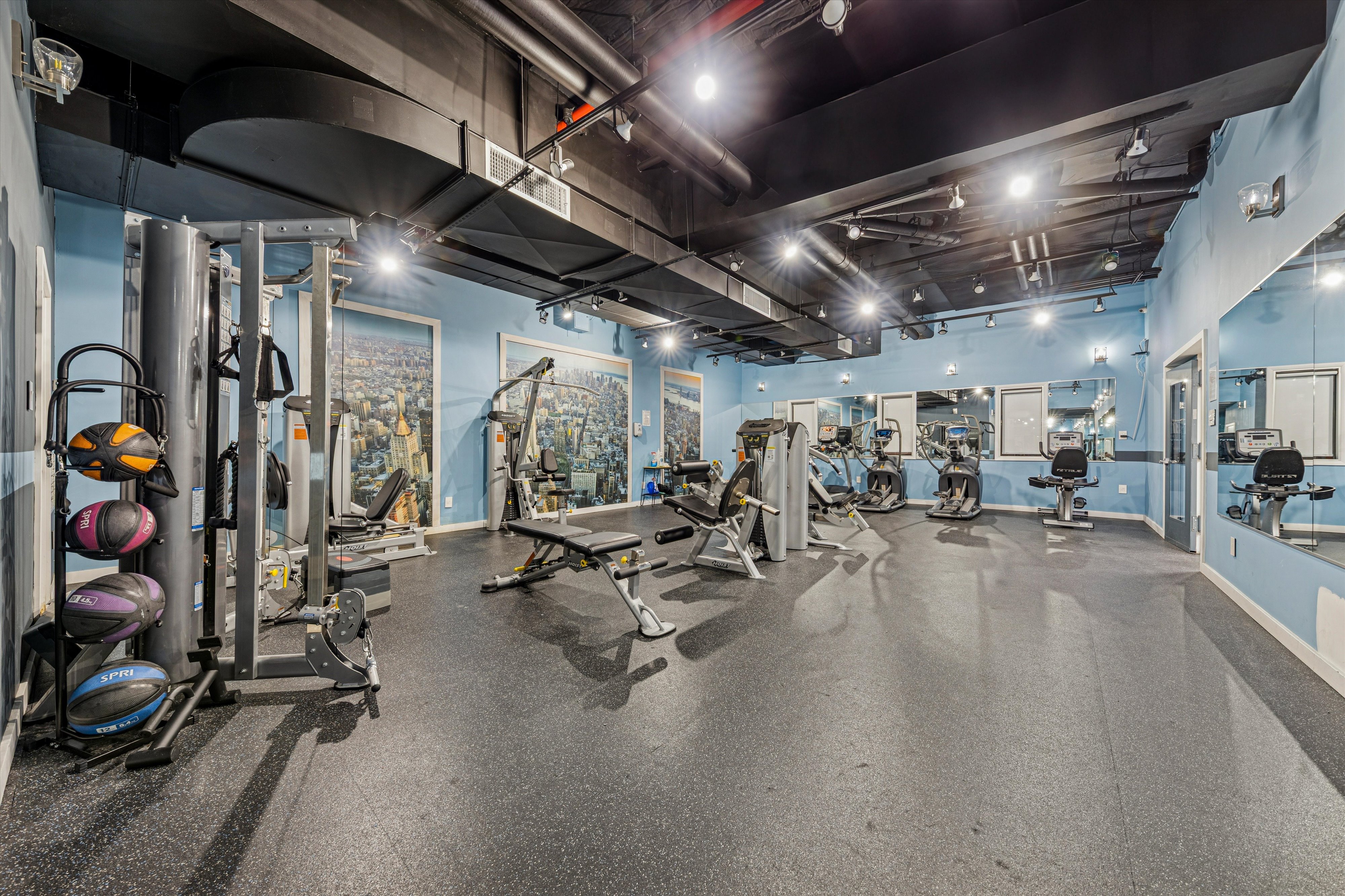 1919 Madison Avenue, Unit 418 Manhattan, NY 10035 - Photo 14 of 16 a view of a room with gym equipment