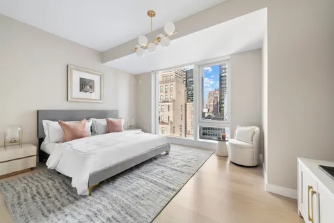 a bedroom with a large bed and a couch