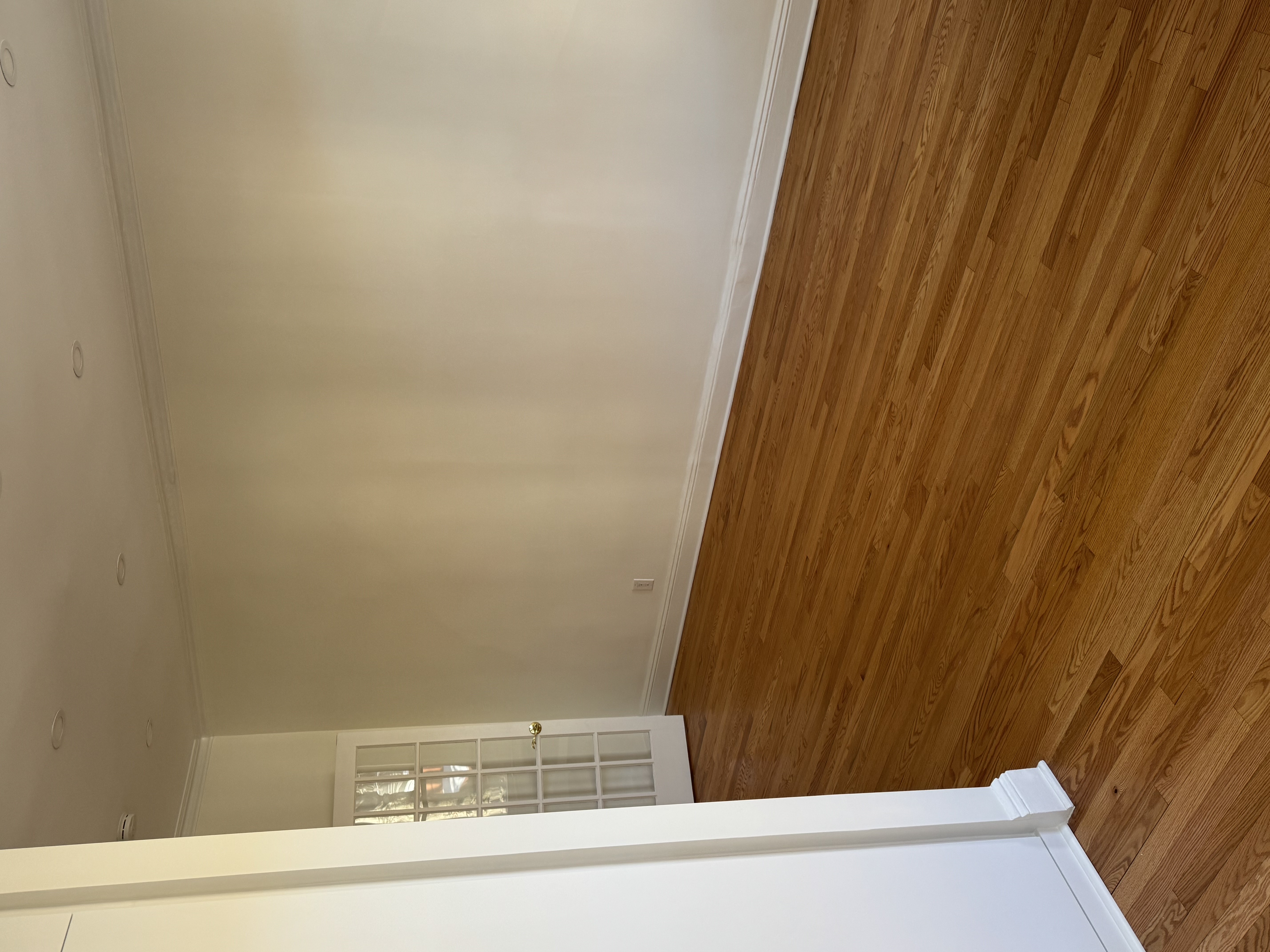 432 36th Street, Unit 2 Brooklyn, NY 11232 - Photo 10 of 11 a view of an empty room with wooden floor and a window