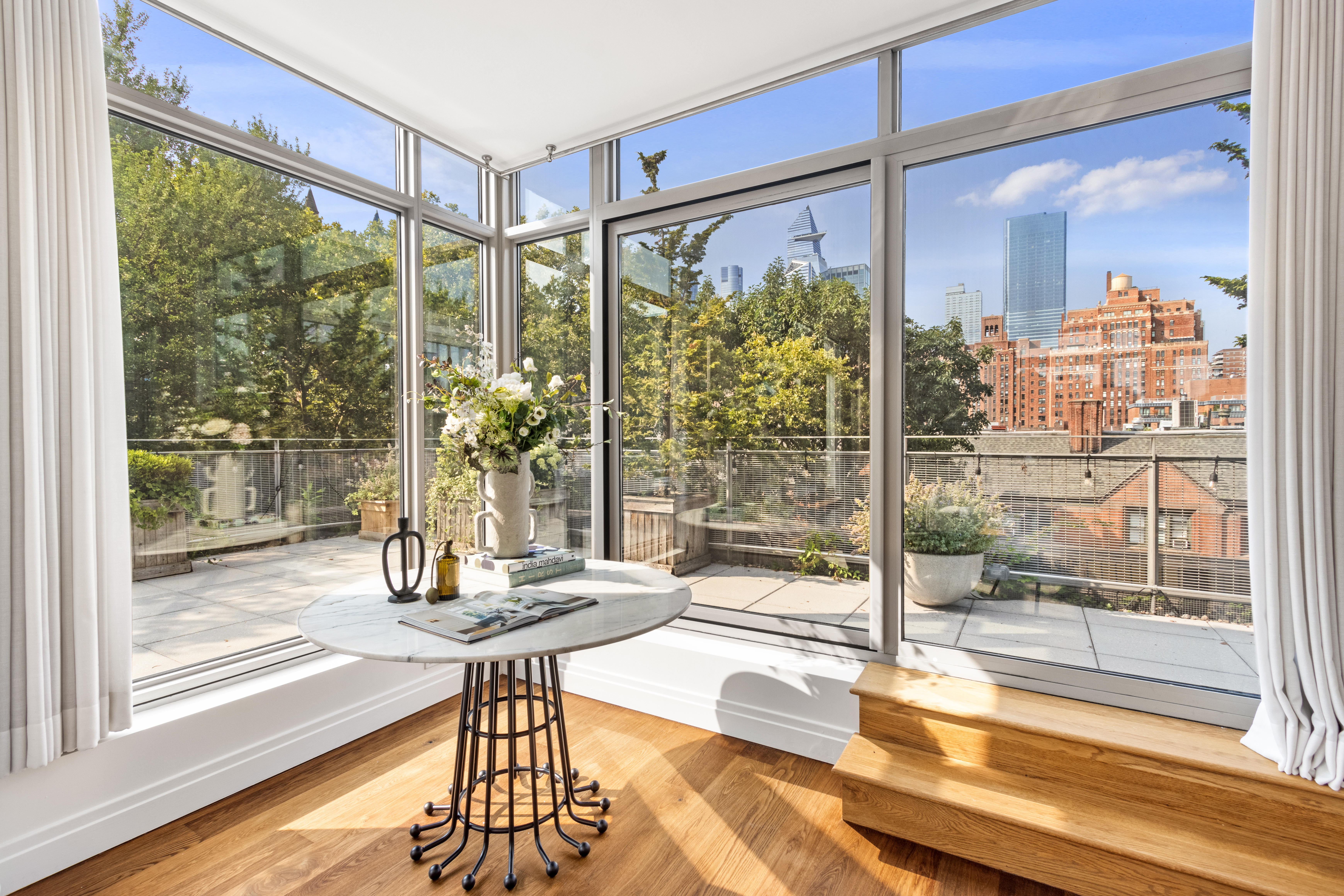 177 9th Avenue, Unit PHA Manhattan, NY 10011 - Photo 2 of 28 a room with pool table and glass windows