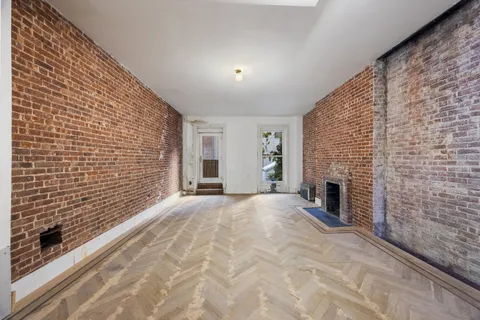a view of empty room with a fireplace
