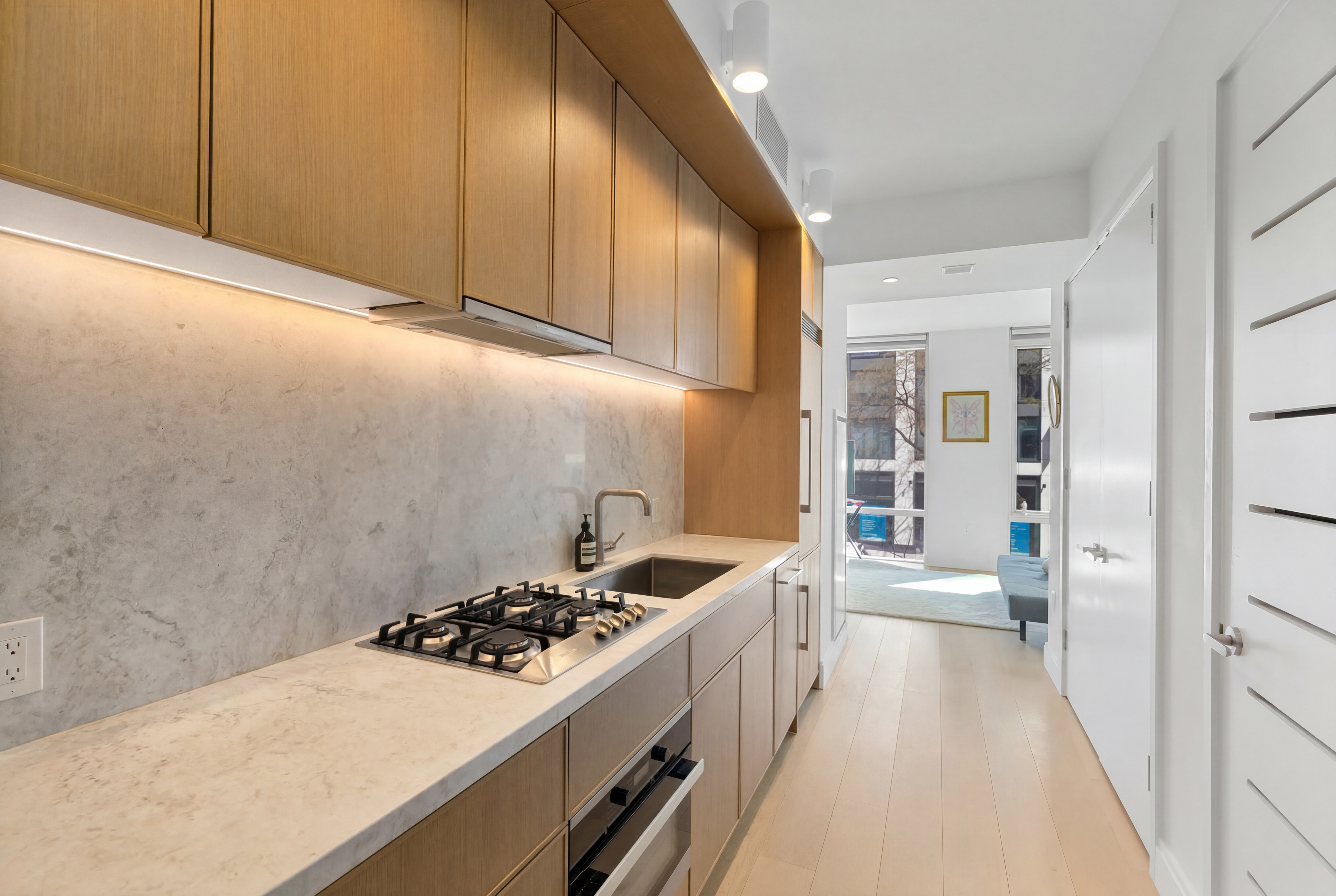 501 3rd Avenue, Unit 3C Manhattan, NY 10016 - Photo 1 of 5 a kitchen with a sink stove and cabinets