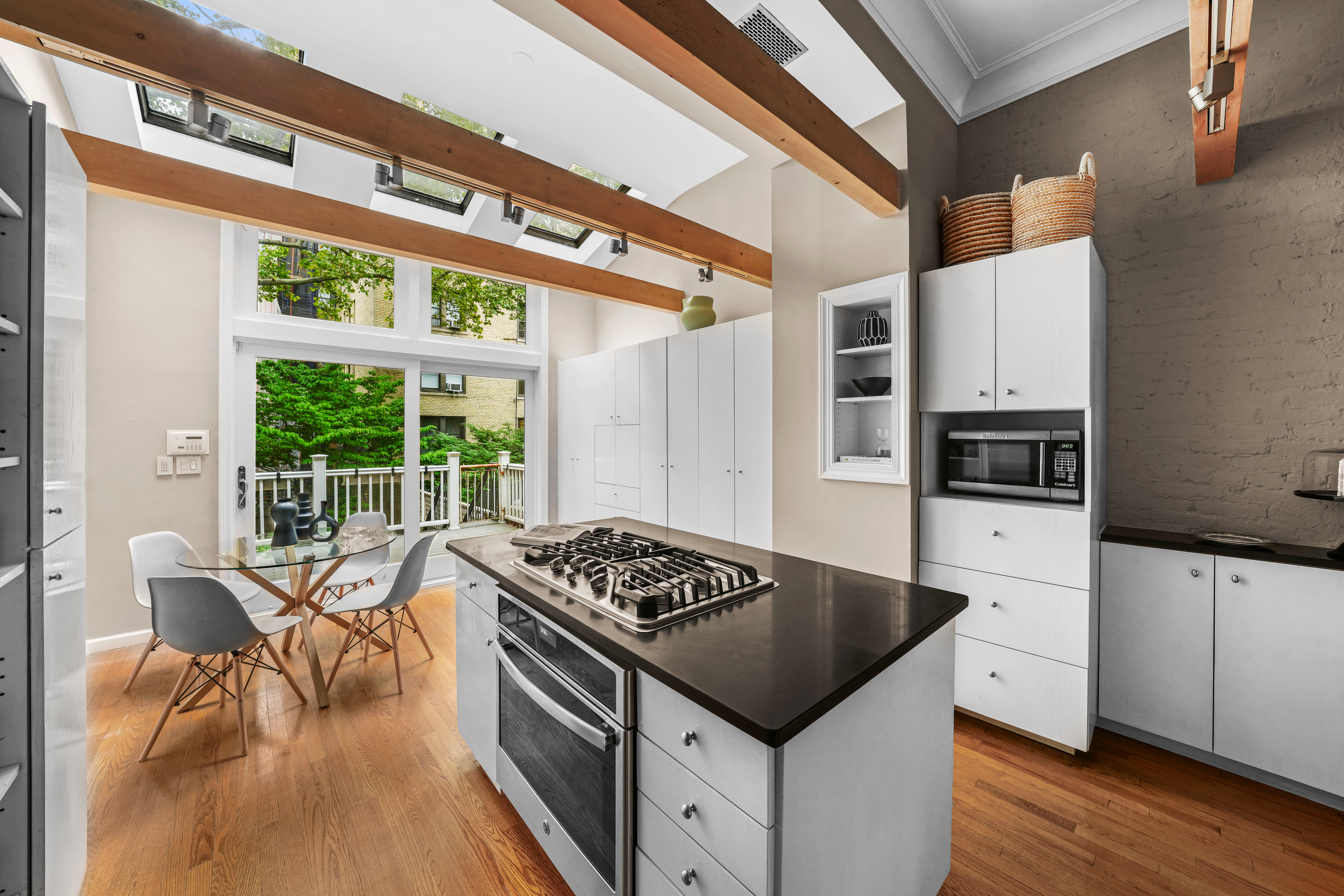247 East 71st Street Manhattan, NY 10021 - Photo 11 of 31 a kitchen with stainless steel appliances granite countertop a stove and a refrigerator