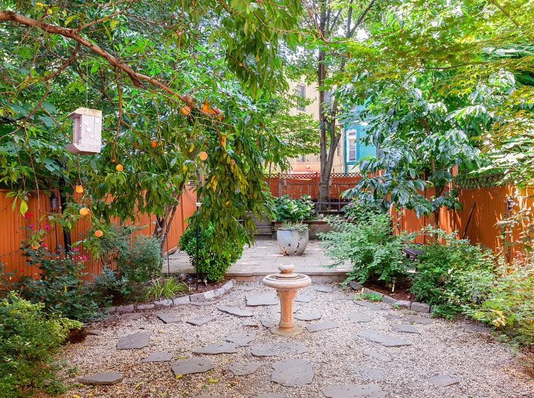 688 Saint Marks Avenue, Unit 1 Brooklyn, NY 11216 - Photo 3 of 10 a lawn chair and fire pit with large trees